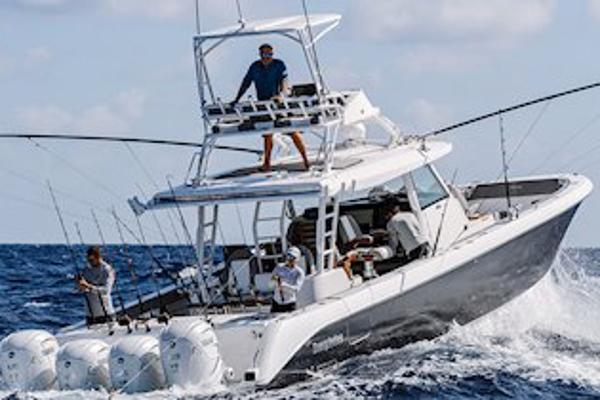 Manufacturer Provided Image: 2025 Everglades 455 Center Console boat navigating ocean waves.