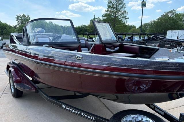 2026 Ranger 1850MS boat in maroon, parked on a trailer, under a clear blue sky.