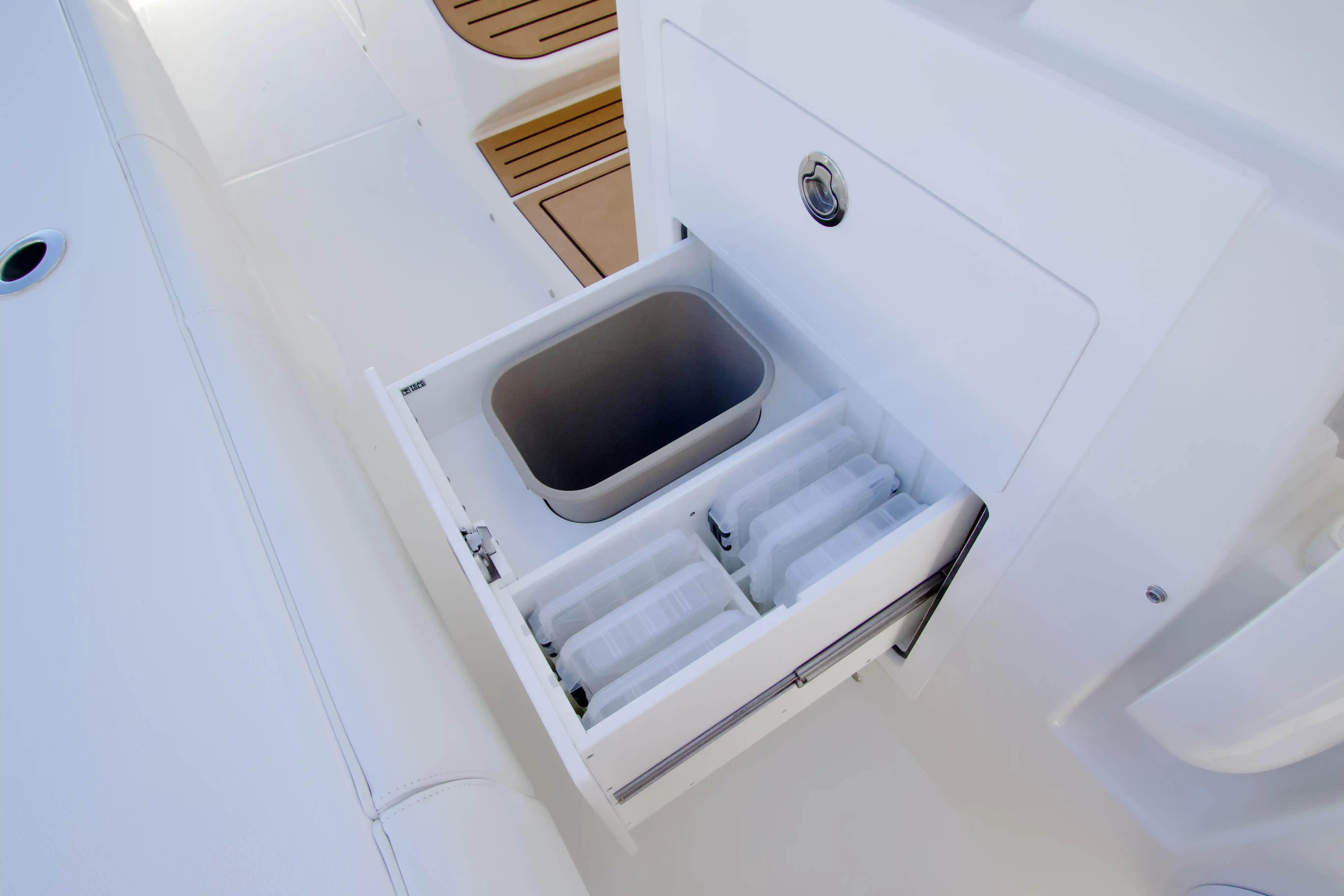 Open storage compartment on 2027 Regulator 35 boat with organized interior.