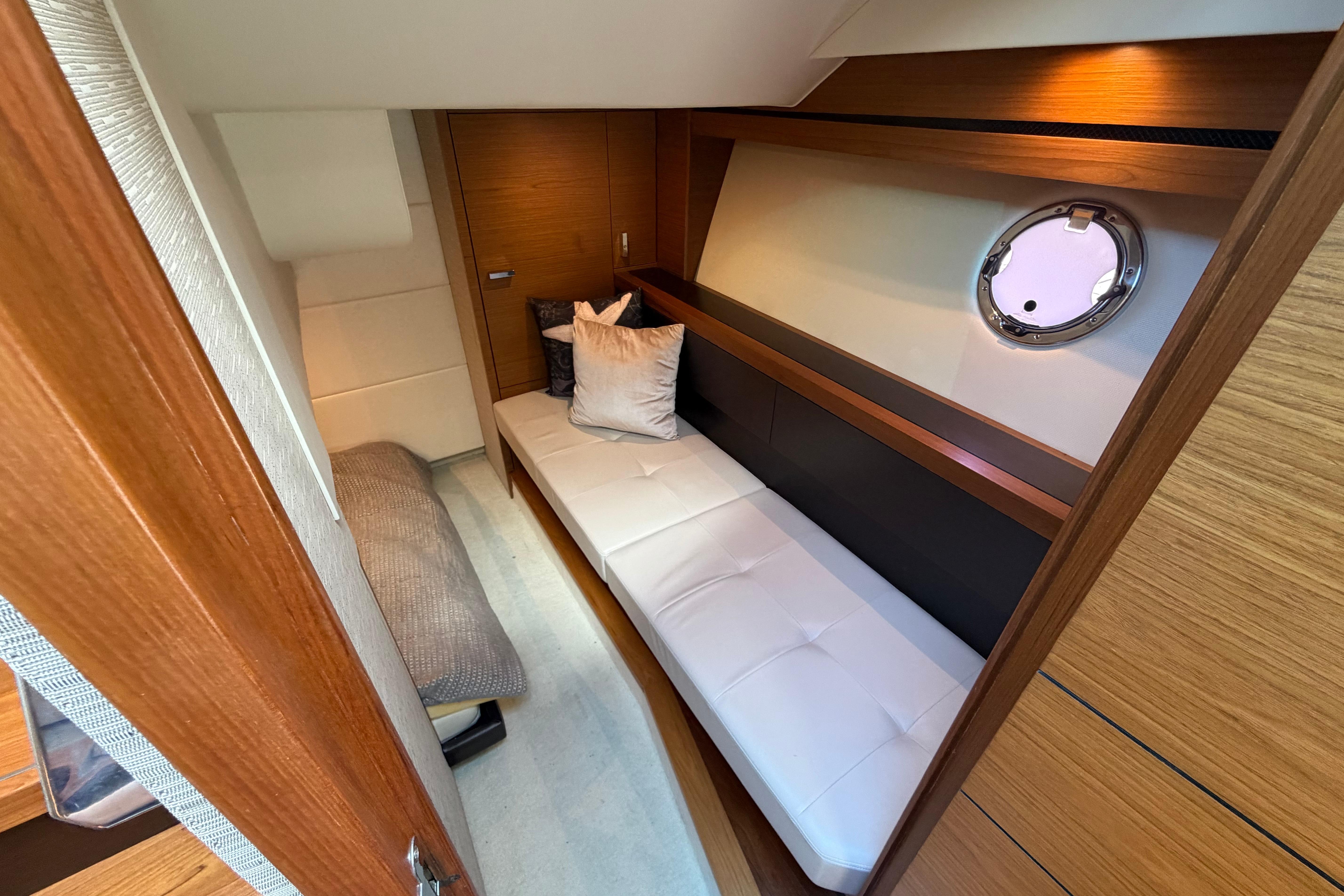 2016 Tiara Yachts C39 Coupe interior cabin with modern wood finish and cozy seating.