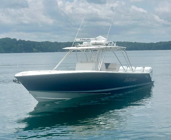2008 SeaVee 390B boat on calm water under cloudy sky.