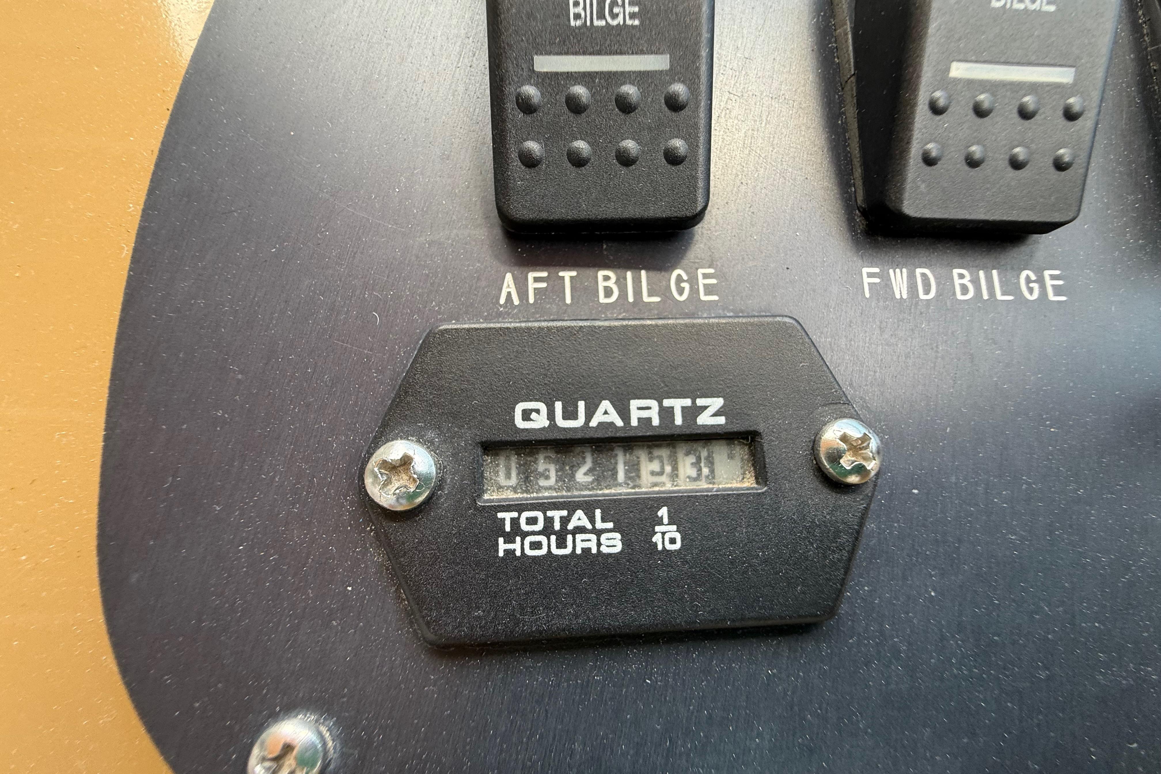 1999 Chaparral Signature 300 bilge control panel with quartz hour meter reading 321.3 hours.