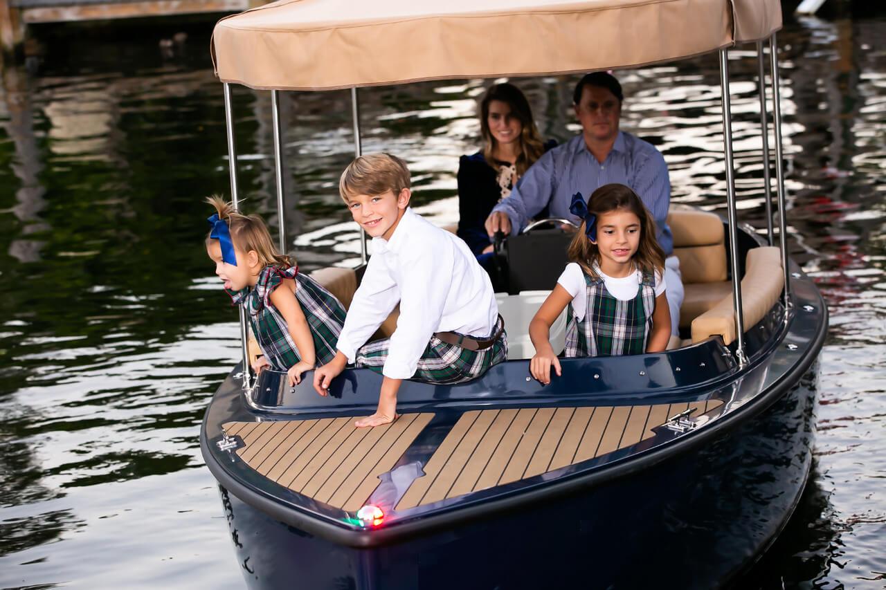 Family enjoying a ride on the 2023 Vision Marine Technologies Fantail 217 boat.