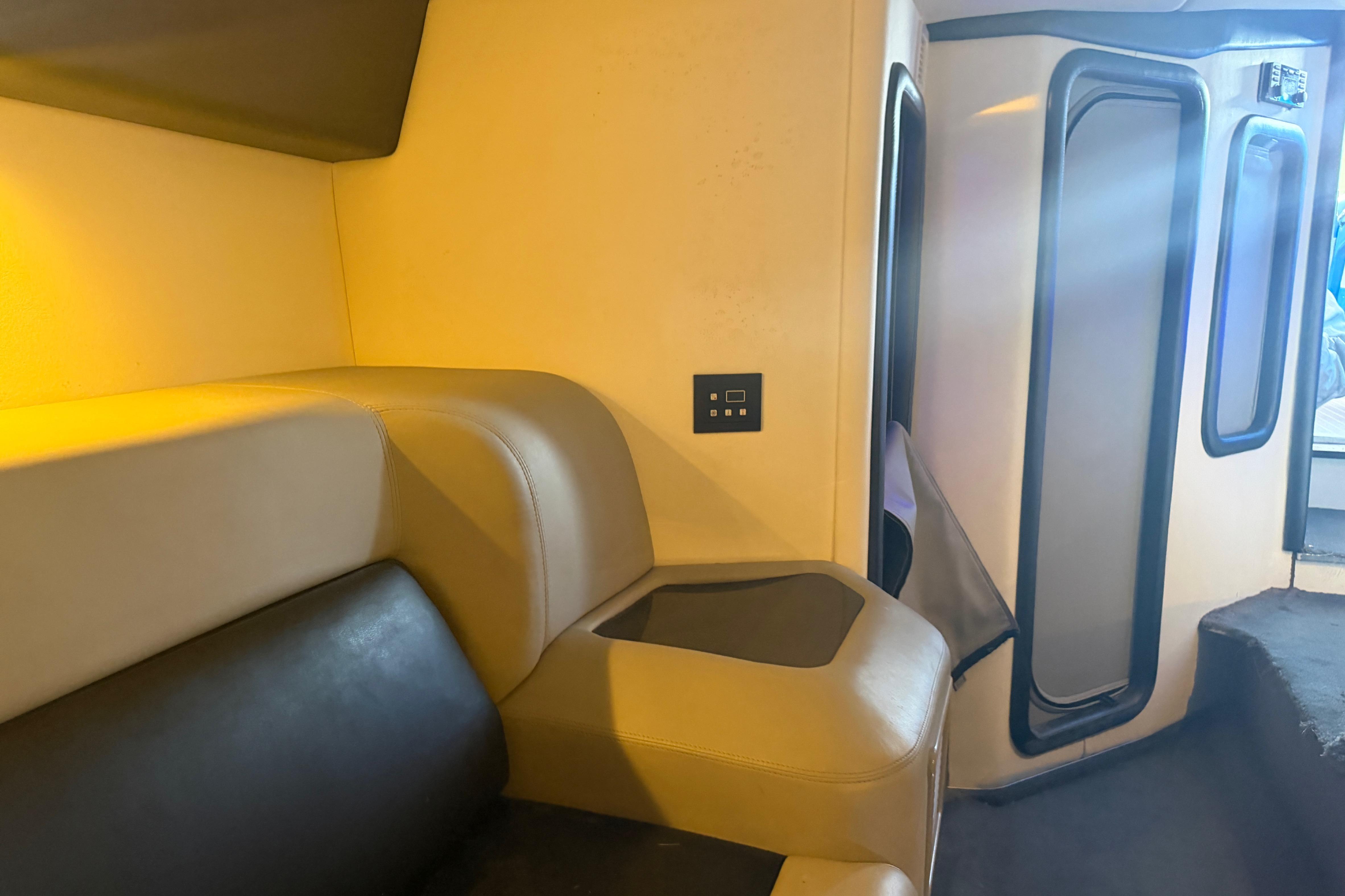 Interior of a 2013 Nor-Tech 477 SPX Vee Bottom boat, featuring beige seating and modern design.