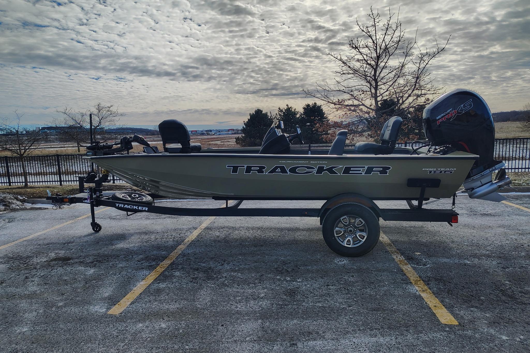2026 Tracker Pro Team 195 boat on trailer in parking lot.