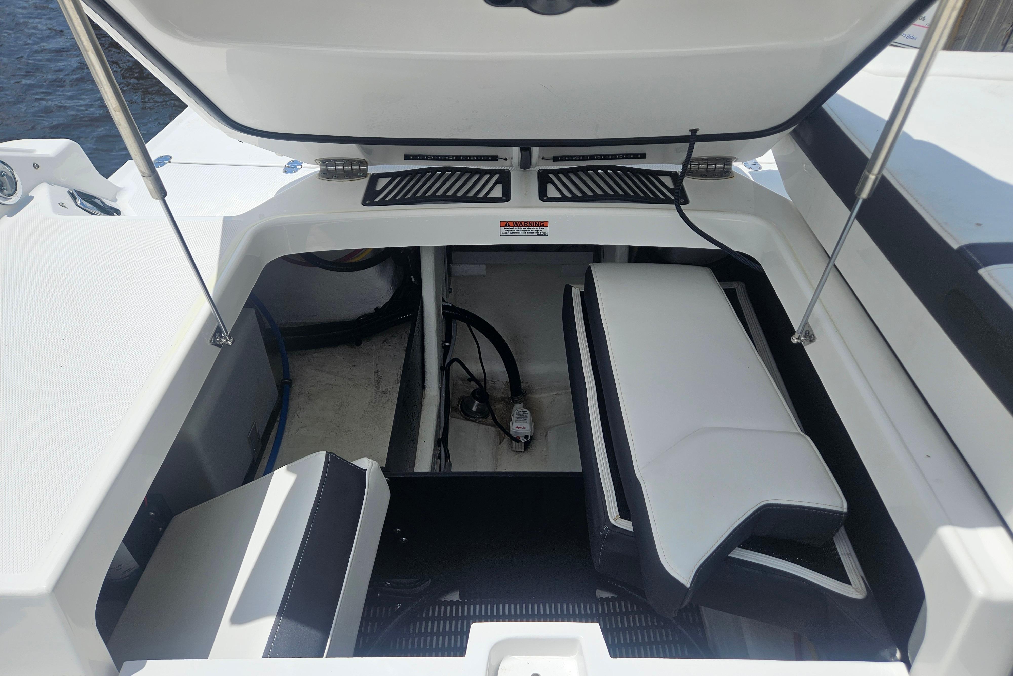 Open engine compartment of 2024 Monterey 215SS Super Sport boat, showcasing interior details.