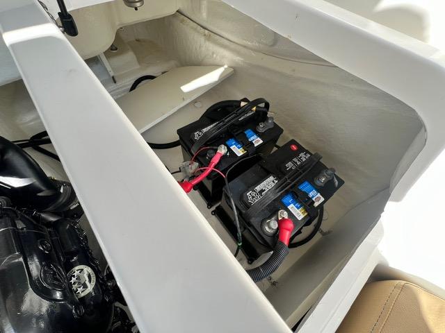 2023 Bayliner DX 2050 boat battery compartment with dual batteries.