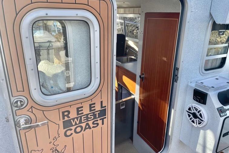 2021 KingFisher 3025 Destination boat interior with "Reel West Coast" door design.