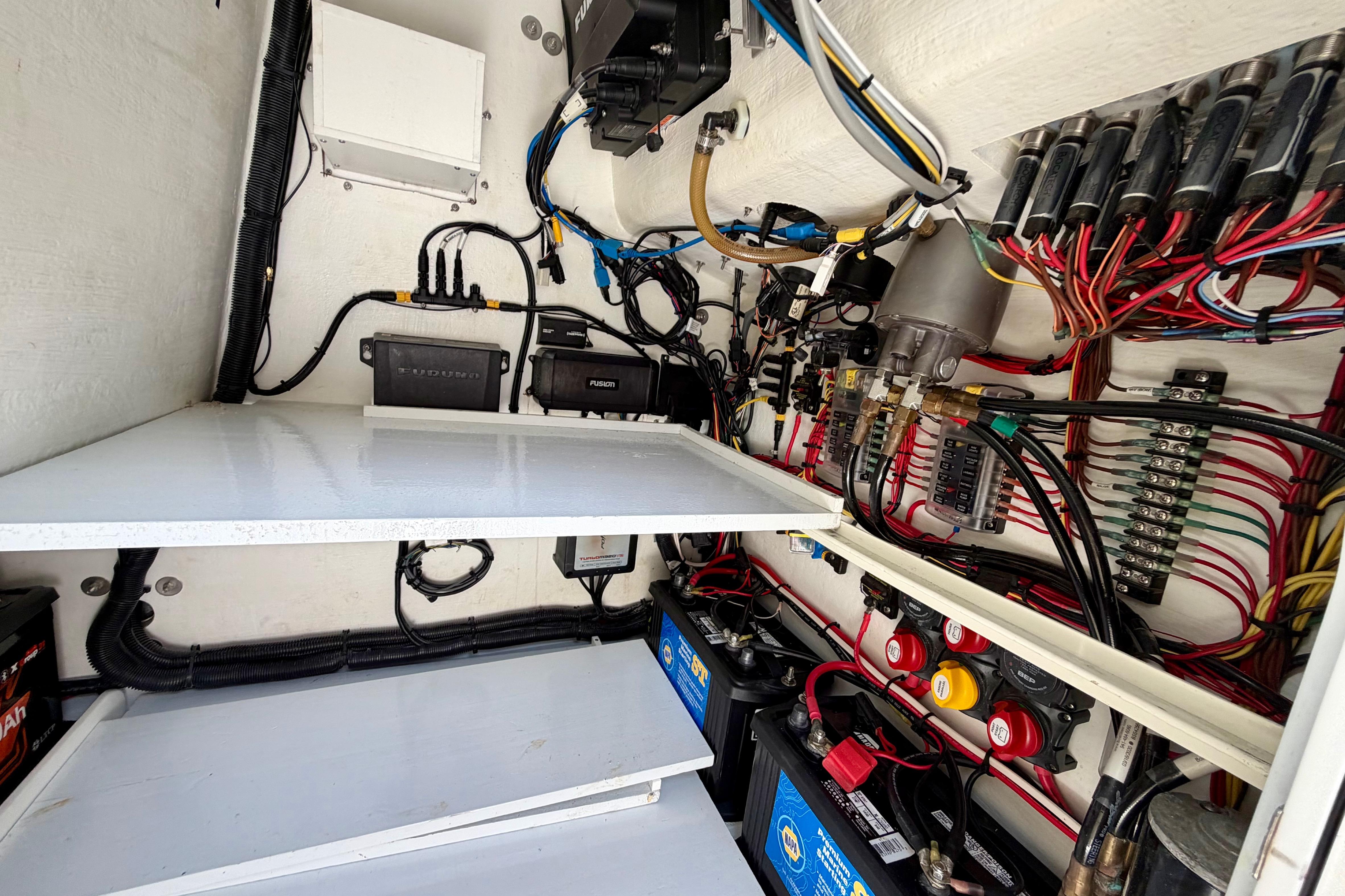 Electrical wiring and components inside a 2025 Ocean Master 296 Center Console boat.