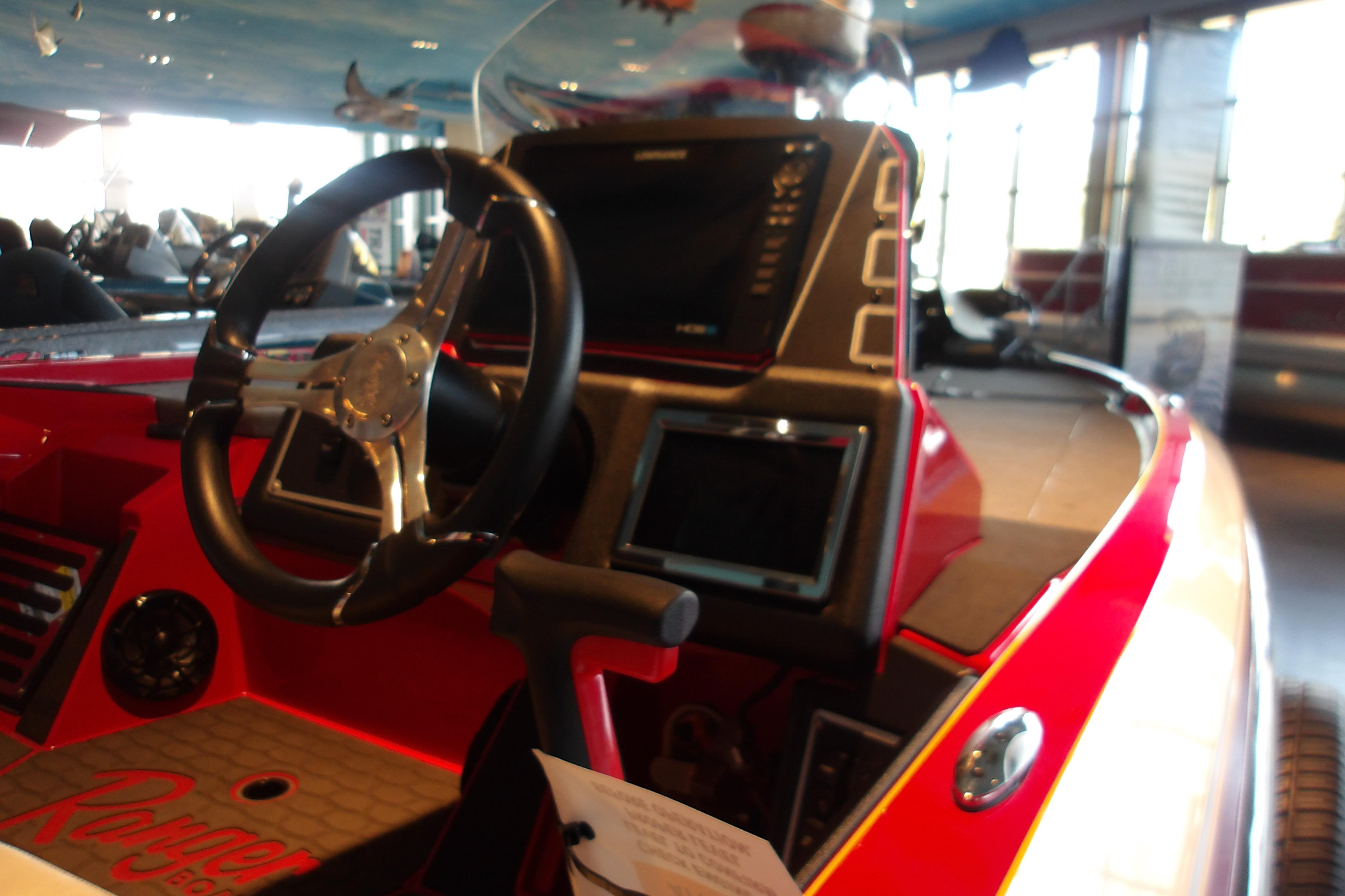 2025 Ranger Z519R Cup-Equipped boat interior with steering wheel and dashboard.