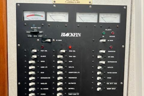 Electrical panel of 1997 Blackfin 30.7 EXPRESS boat with various switches and gauges.