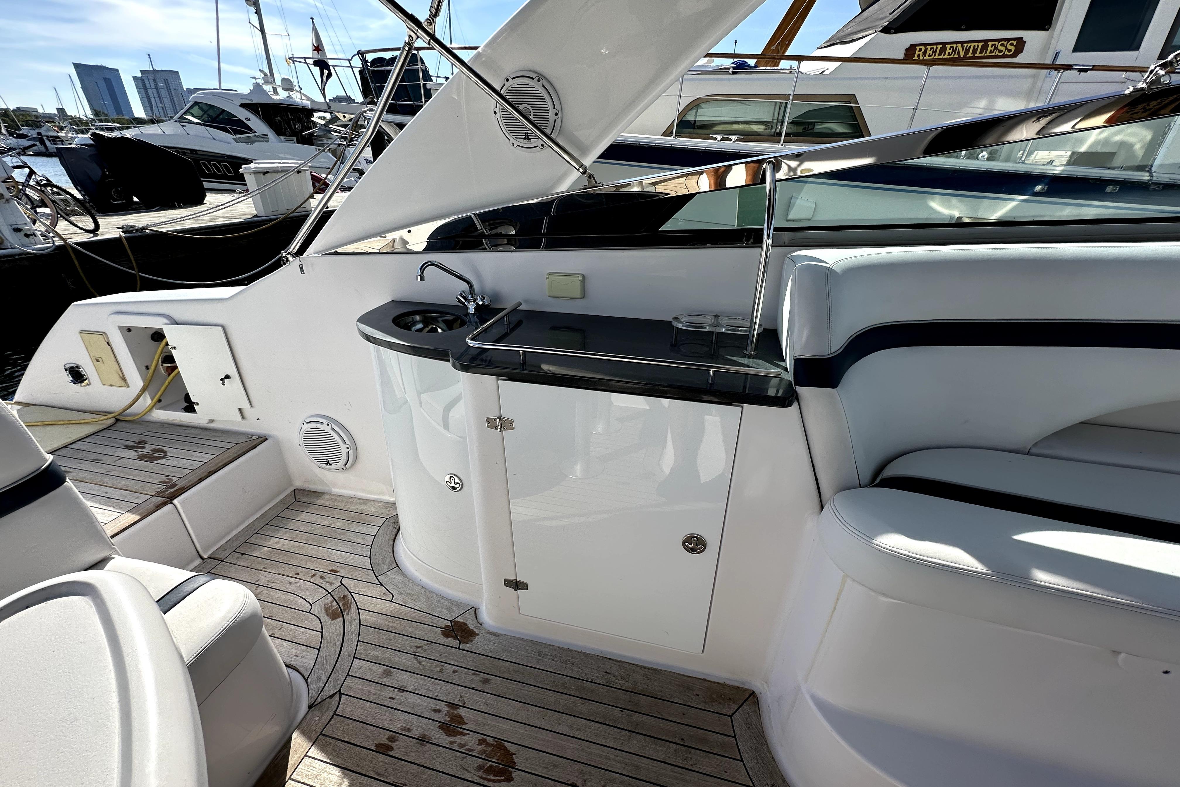 2003 Donzi 39 ZSC yacht interior with sleek seating and compact kitchenette.