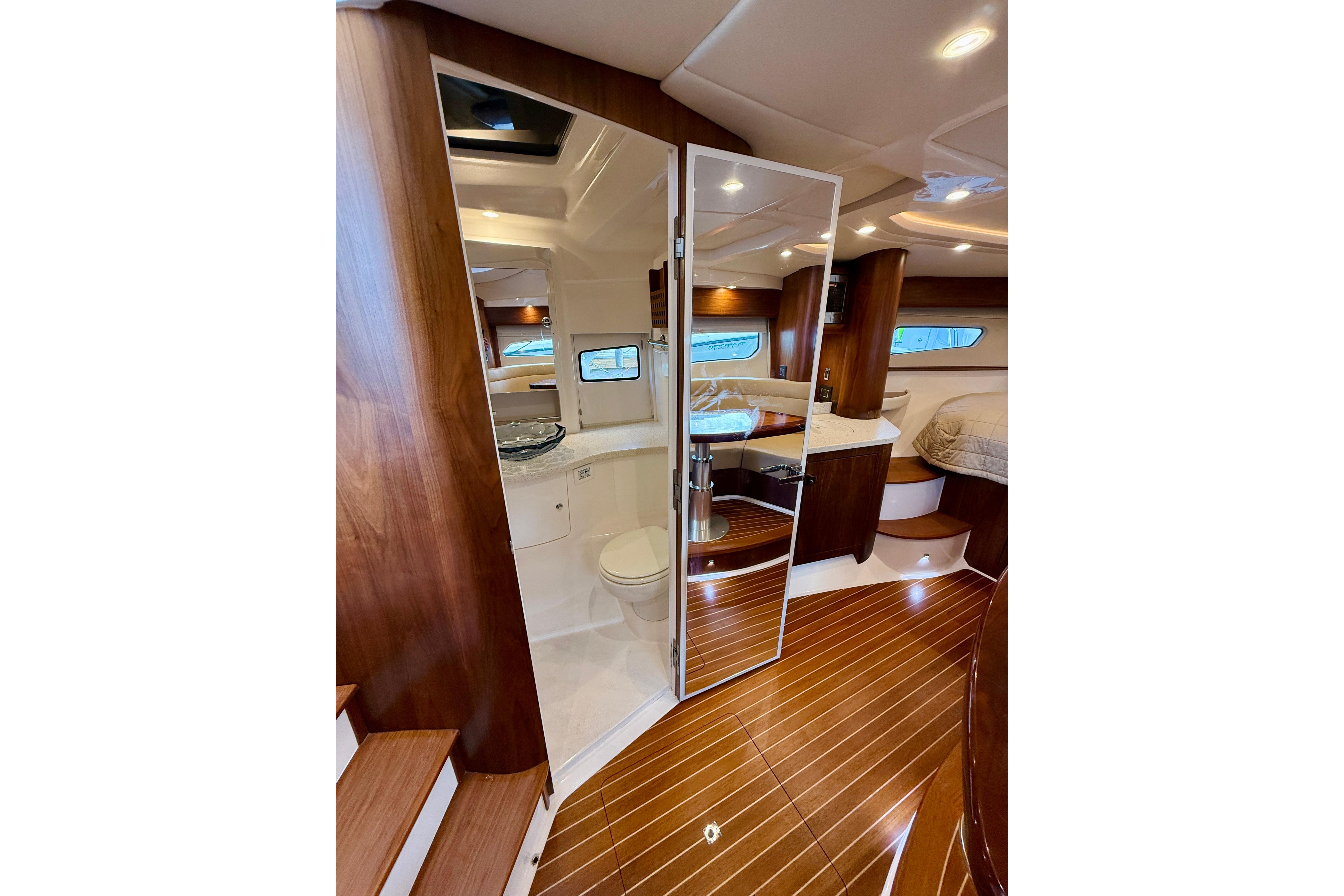 Luxurious interior of 2021 Intrepid 410 Evolution yacht with wood finishes and modern amenities.