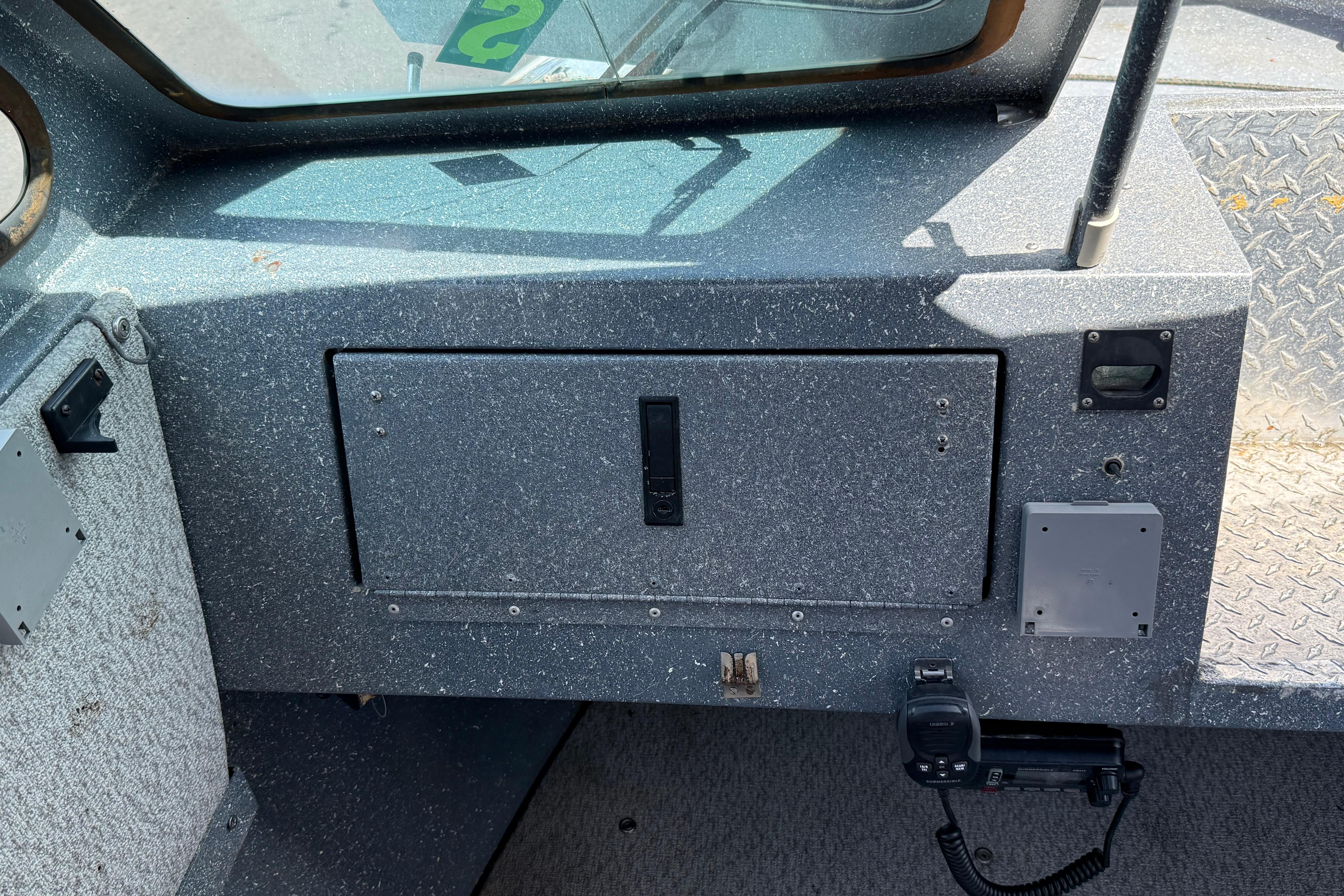 Interior dashboard of a 1991 Fish Rite Fish Custom 22' boat, featuring control panels.