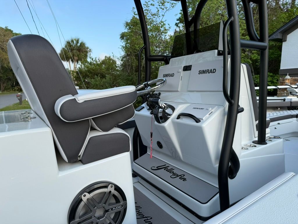 The image shows the cockpit of a 2020 Yellowfin 26 Hybrid boat with modern equipment.