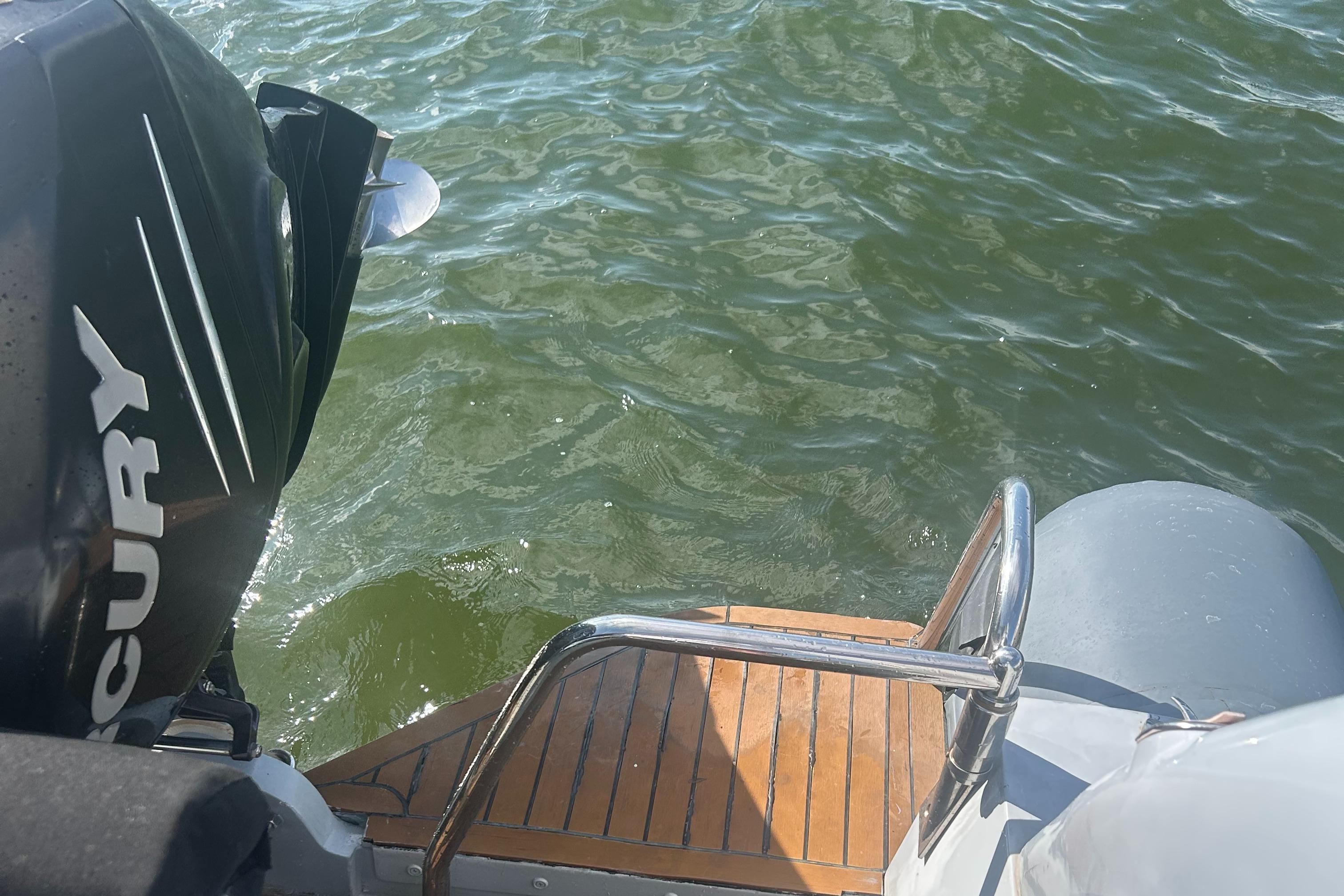 RIB U-23 Carbon Hull boat with Mercury engine on water, 2008 model.