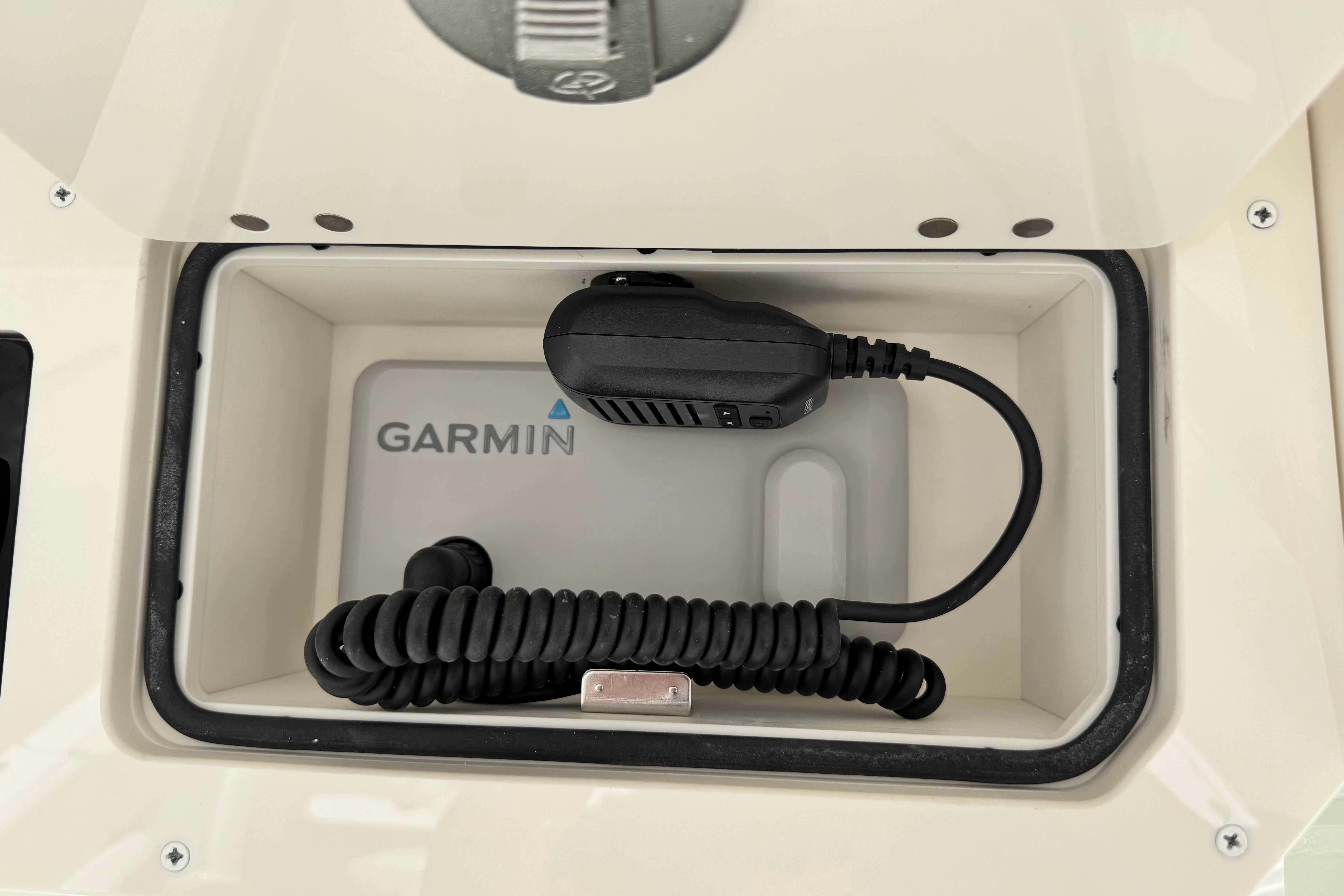 Garmin device in Sailfish 272 CC boat compartment, 2026 model.