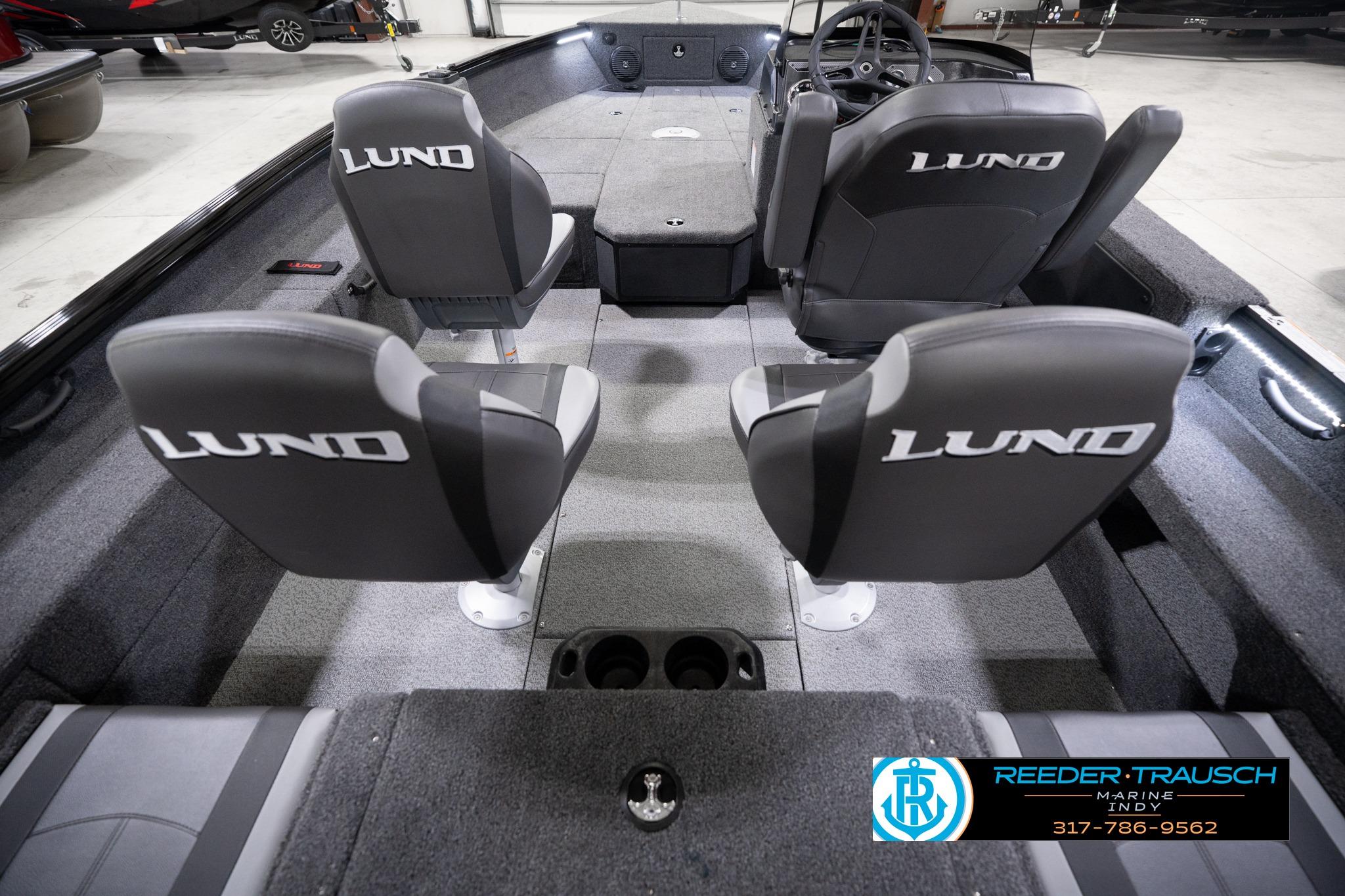 2026 Lund 1775 Impact XS SS boat interior with four seats and steering console.