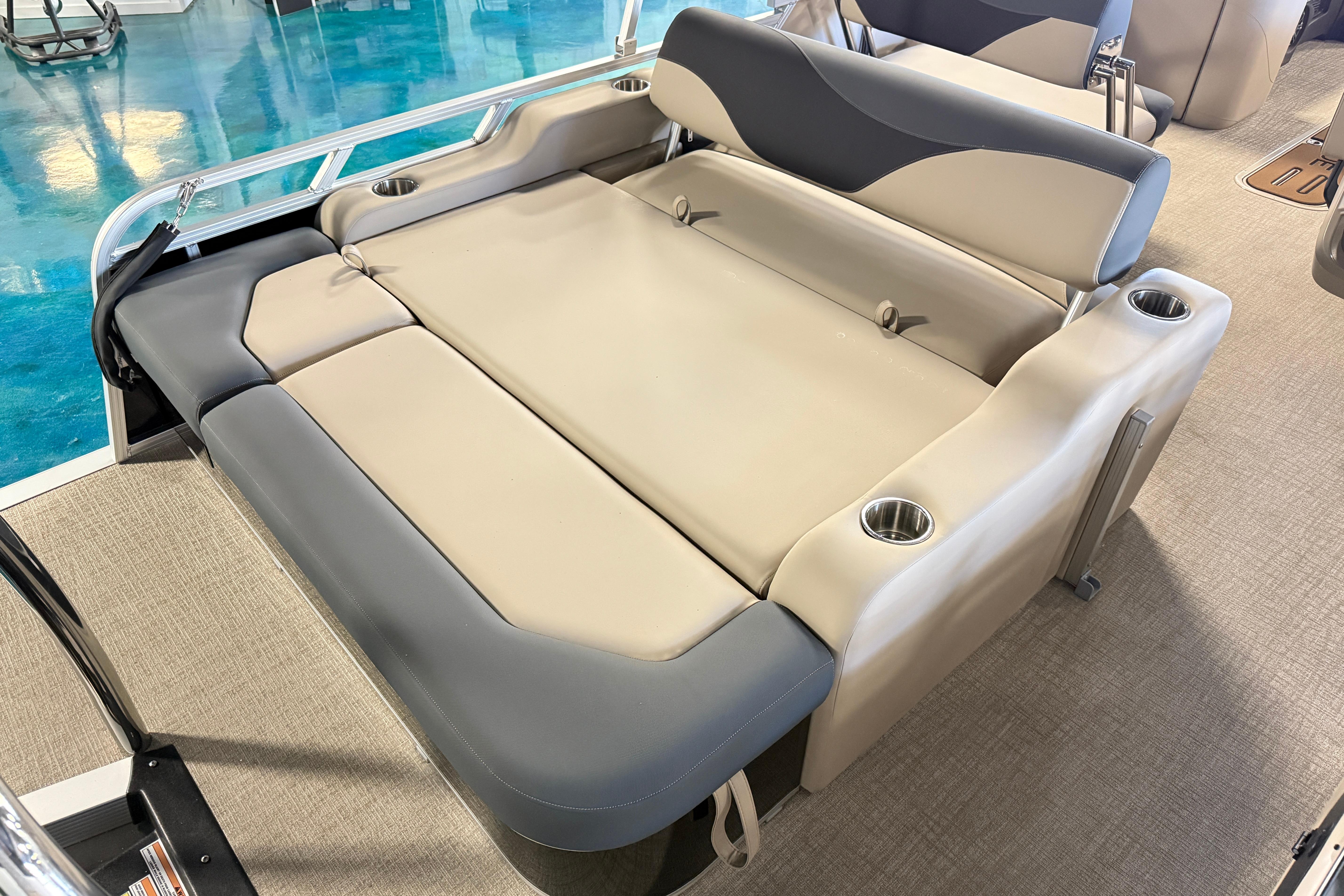 2026 Tahoe Pontoon LTZ Entertainer with luxurious seating and cup holders.