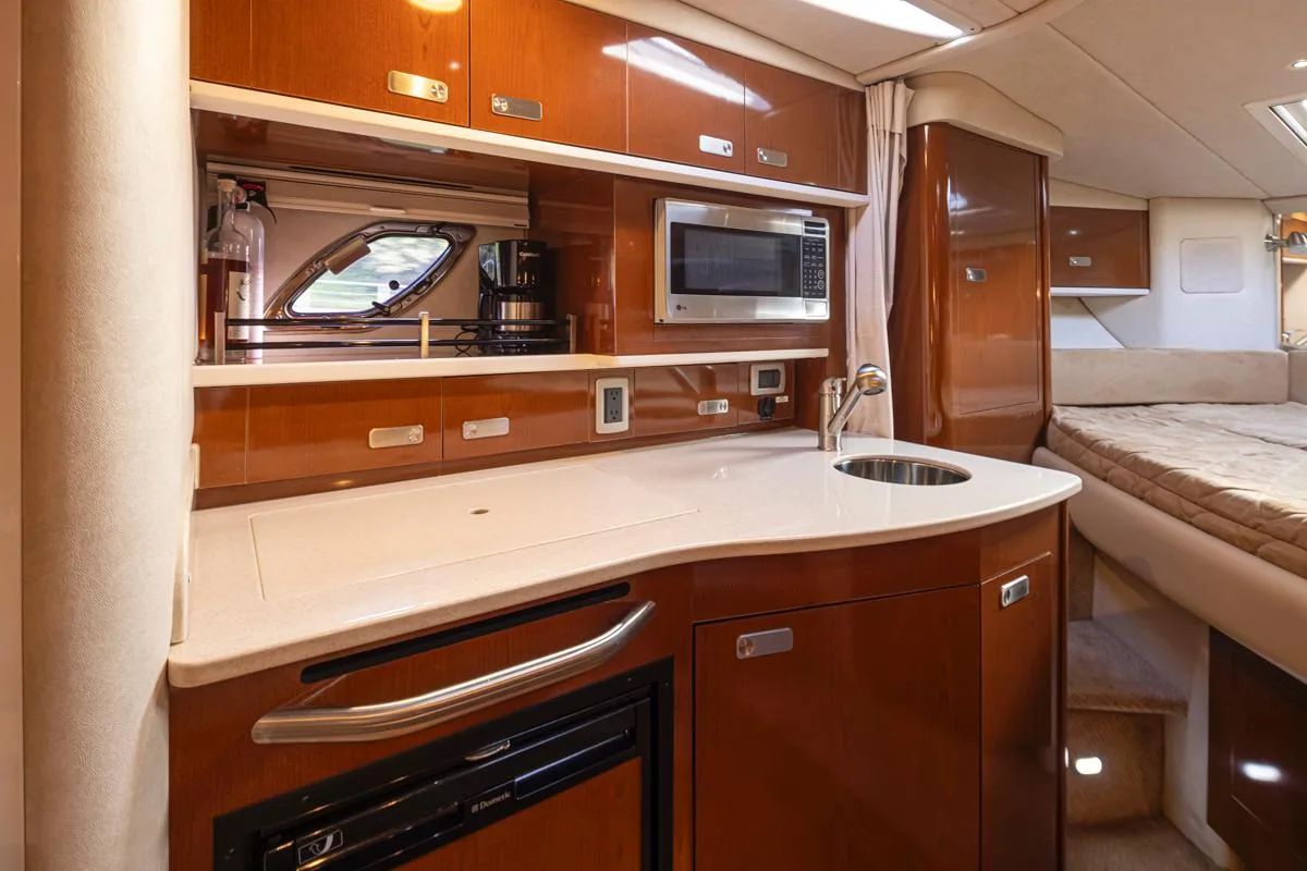 Interior of 2011 Sea Ray Sundancer 330 yacht featuring modern kitchen.