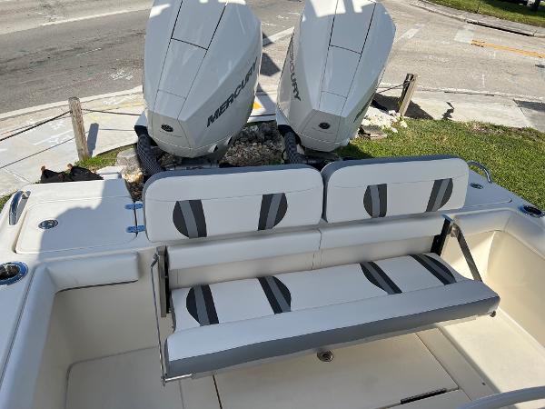 2024 ShearWater 270 SS Open Carolina boat with dual Mercury engines and cushioned seating.