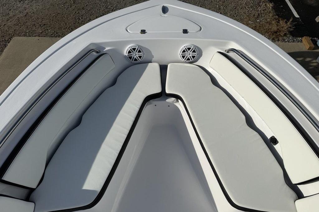 2026 Tidewater 198 CC Adventure boat interior with cushioned seating and speakers.