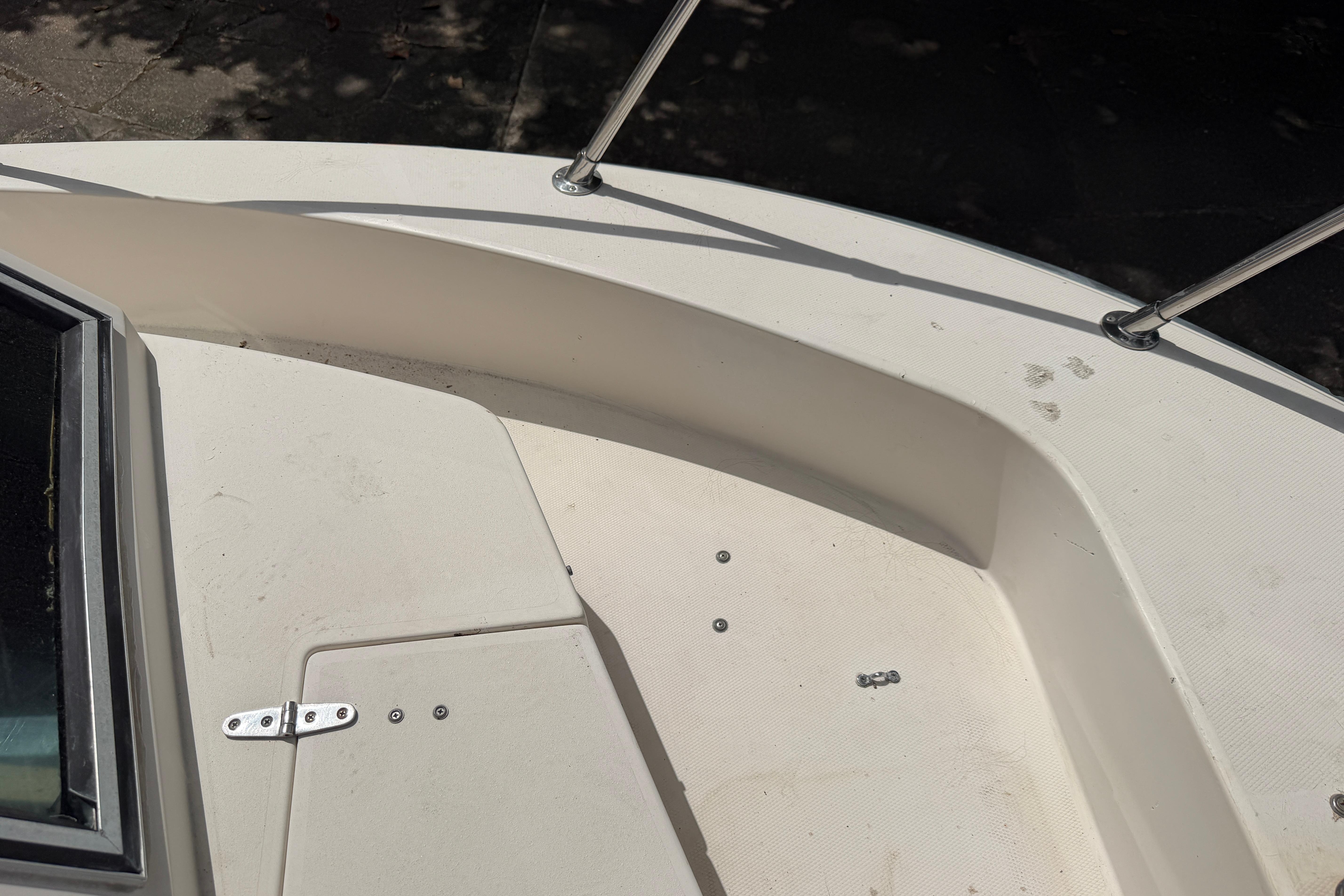 1987 Grady-White Seafarer 226 boat deck with railing and hatch detail.