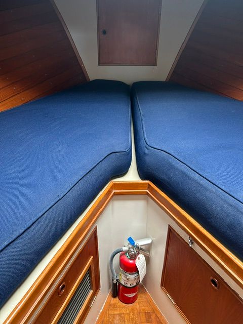Interior of a 1980 Grand Banks 32 Sedan with blue cushions.
