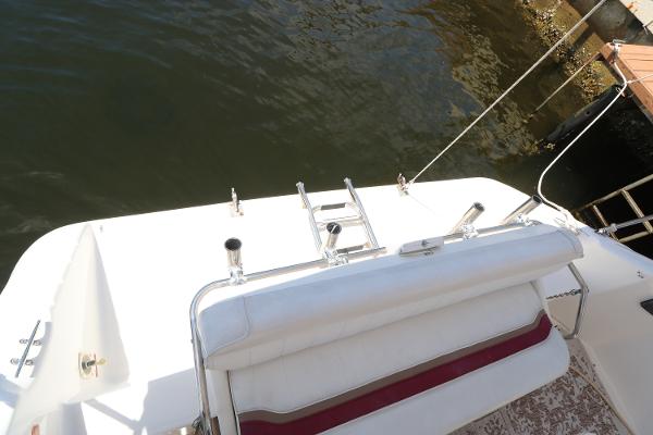 1992 Sea Ray 350 Express Bridge boat stern view with swim platform and ladder.