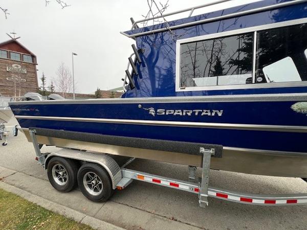 2024 Spartan 26 Maximus Pro XL boat on trailer, blue exterior.