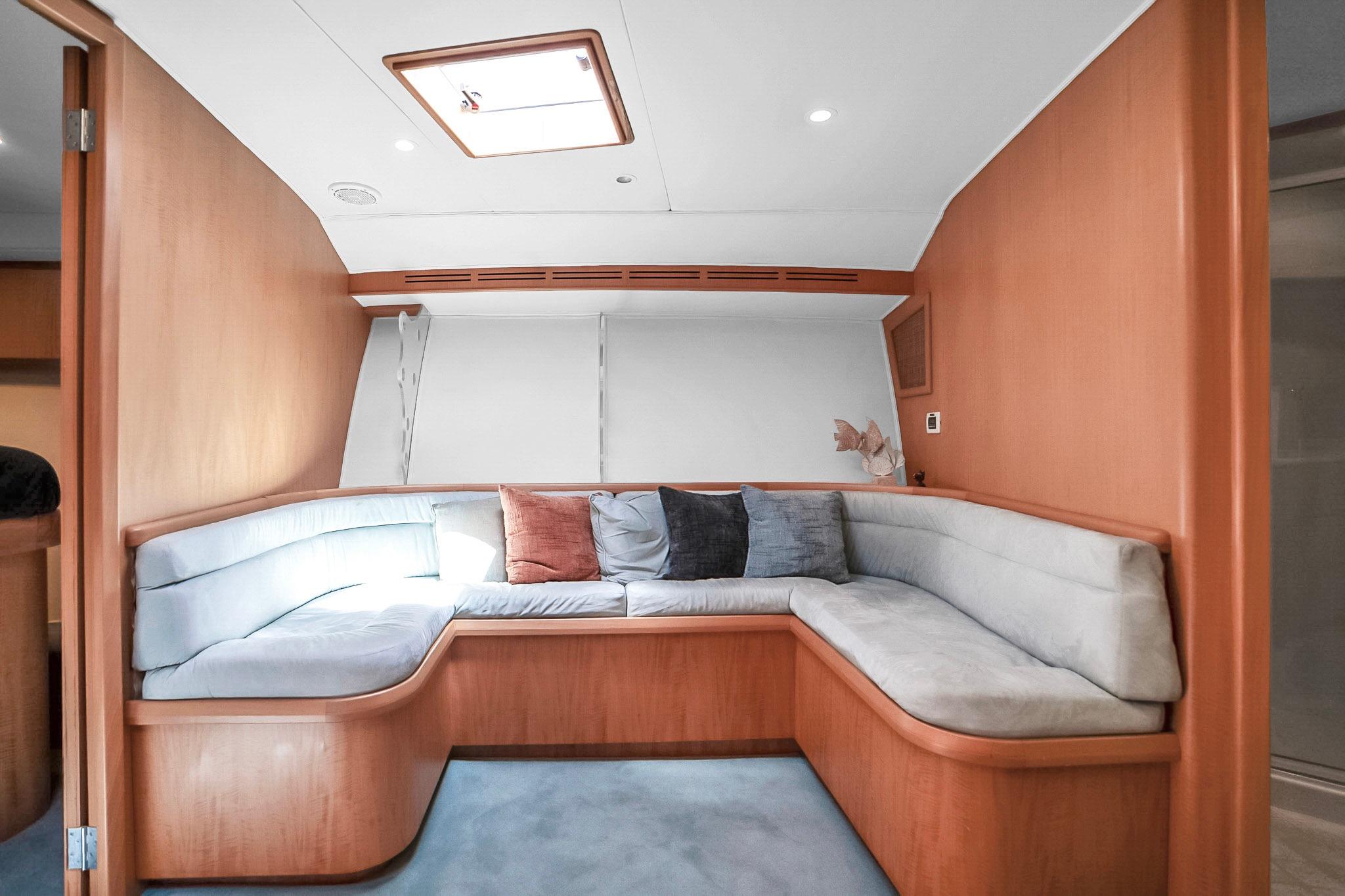 Luxurious interior of 2006 Dixon 52 yacht with cozy seating and modern design.