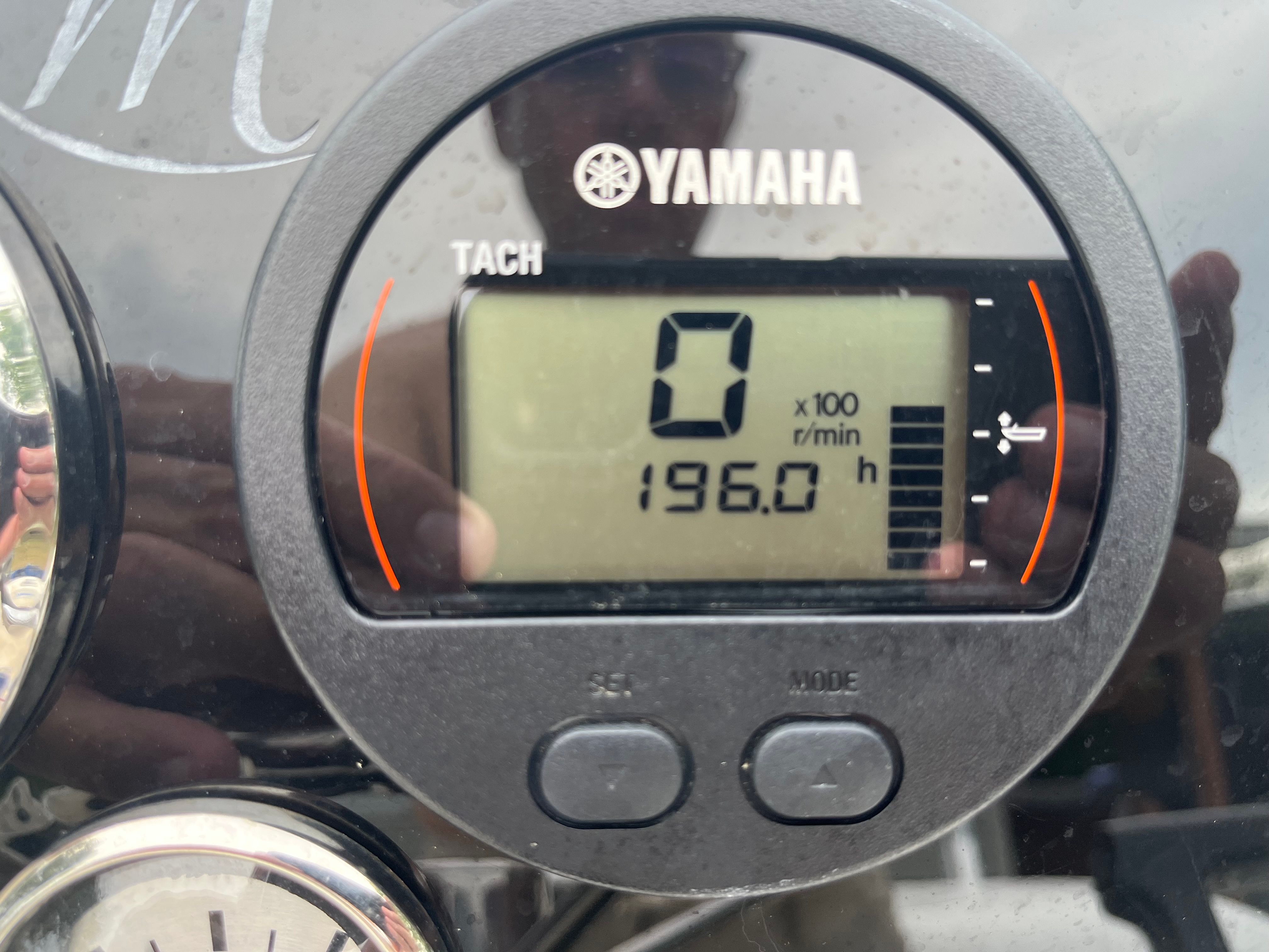 Close-up of a Yamaha tachometer showing 196 operating hours.