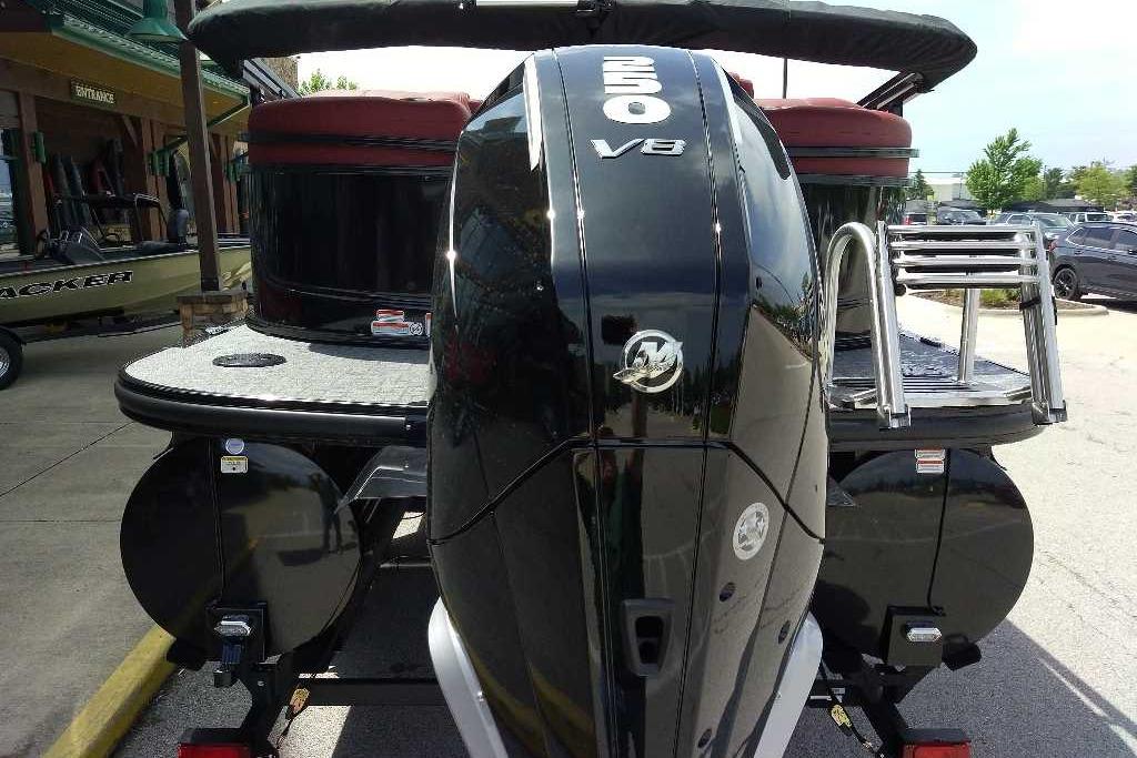 2026 Regency 230 DL boat with powerful 250 V8 engine, parked outdoors.