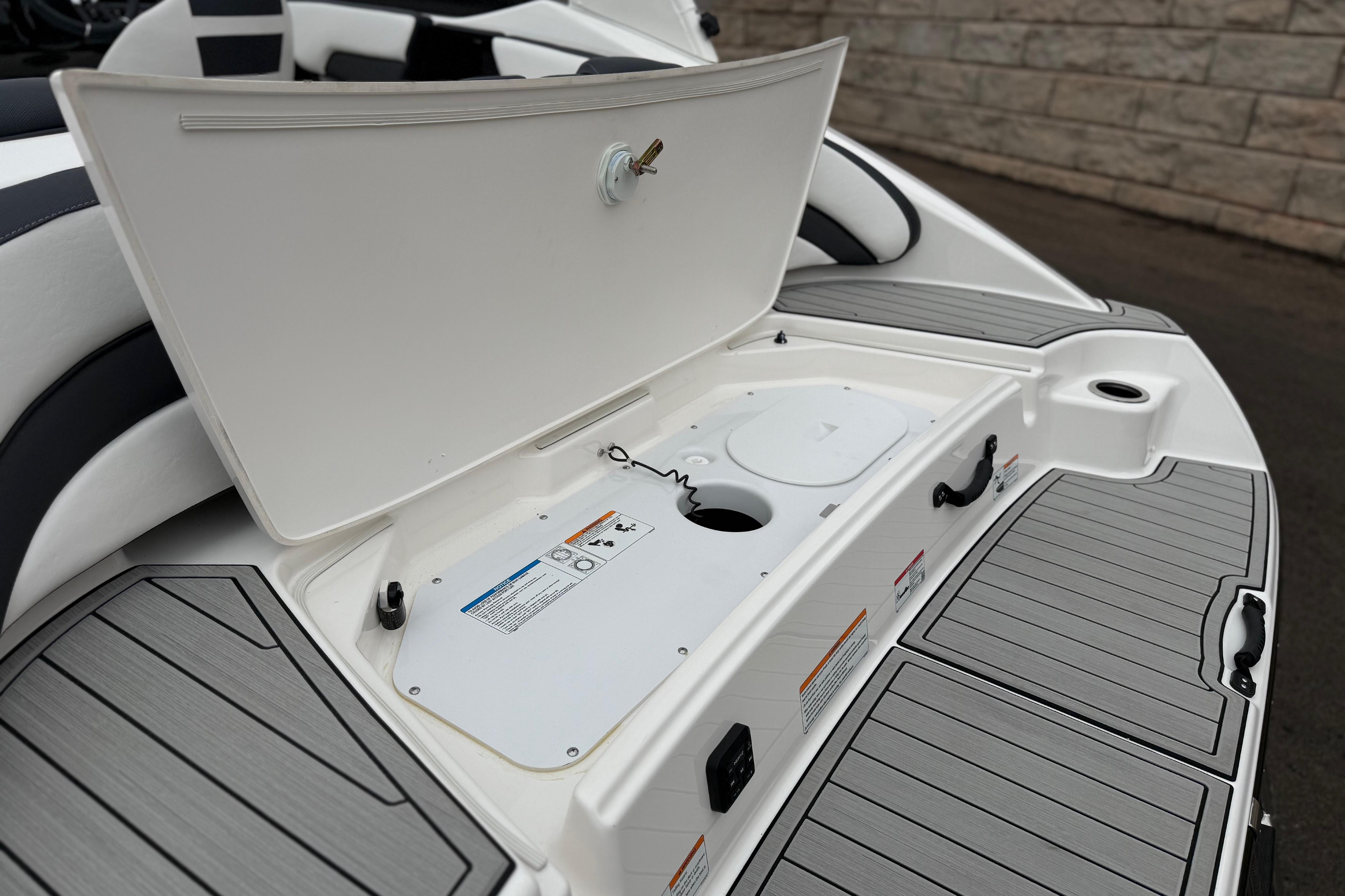 2025 Yamaha Boats 195S storage compartment with open hatch, showcasing sleek design and functionality.