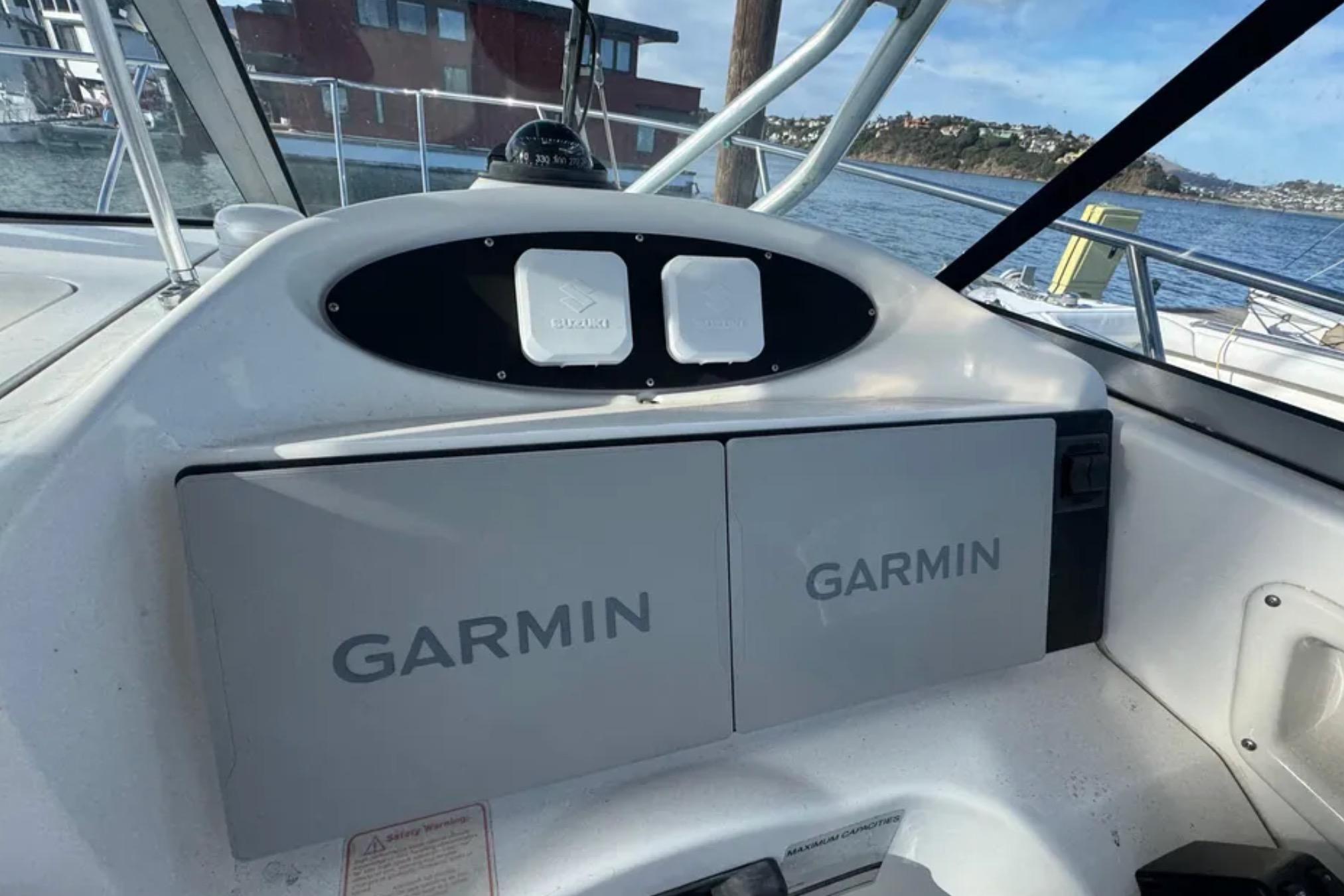2004 Boston Whaler 255 Conquest boat dashboard with Garmin navigation system.