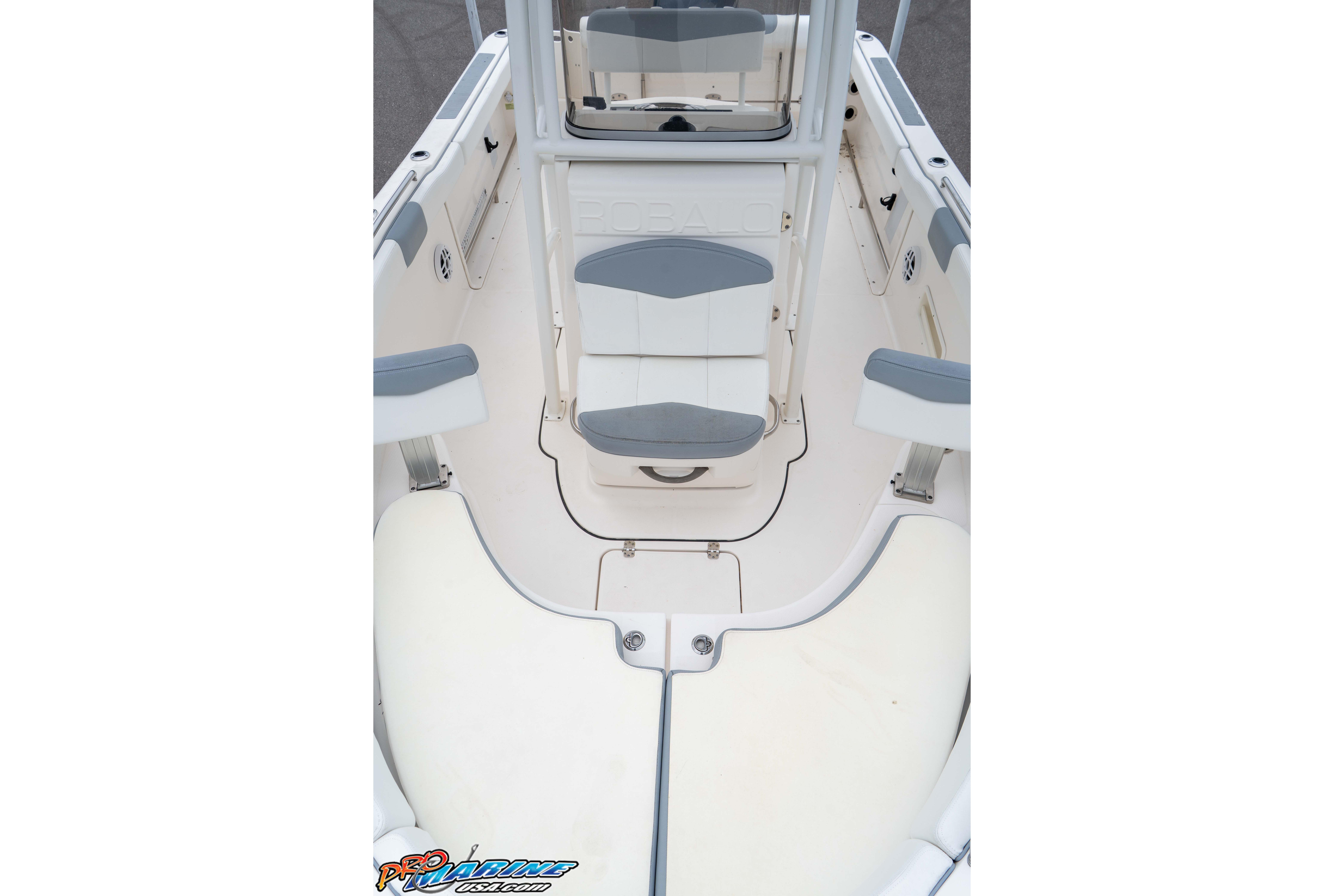 2021 Robalo R222 Center Console boat interior with seating and storage compartments.