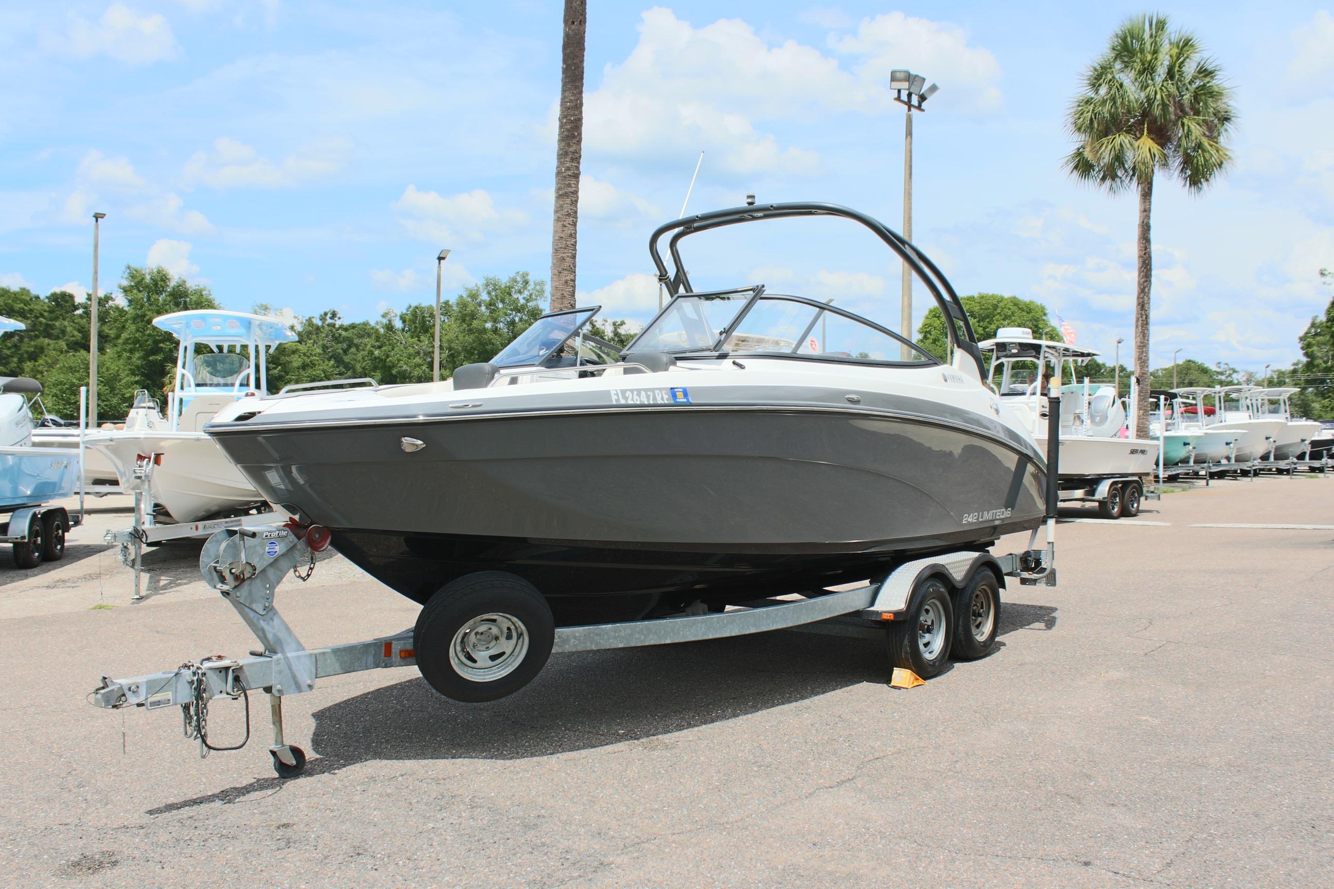 2016 Yamaha Boats 242 Limited S on trailer in sunny outdoor setting.