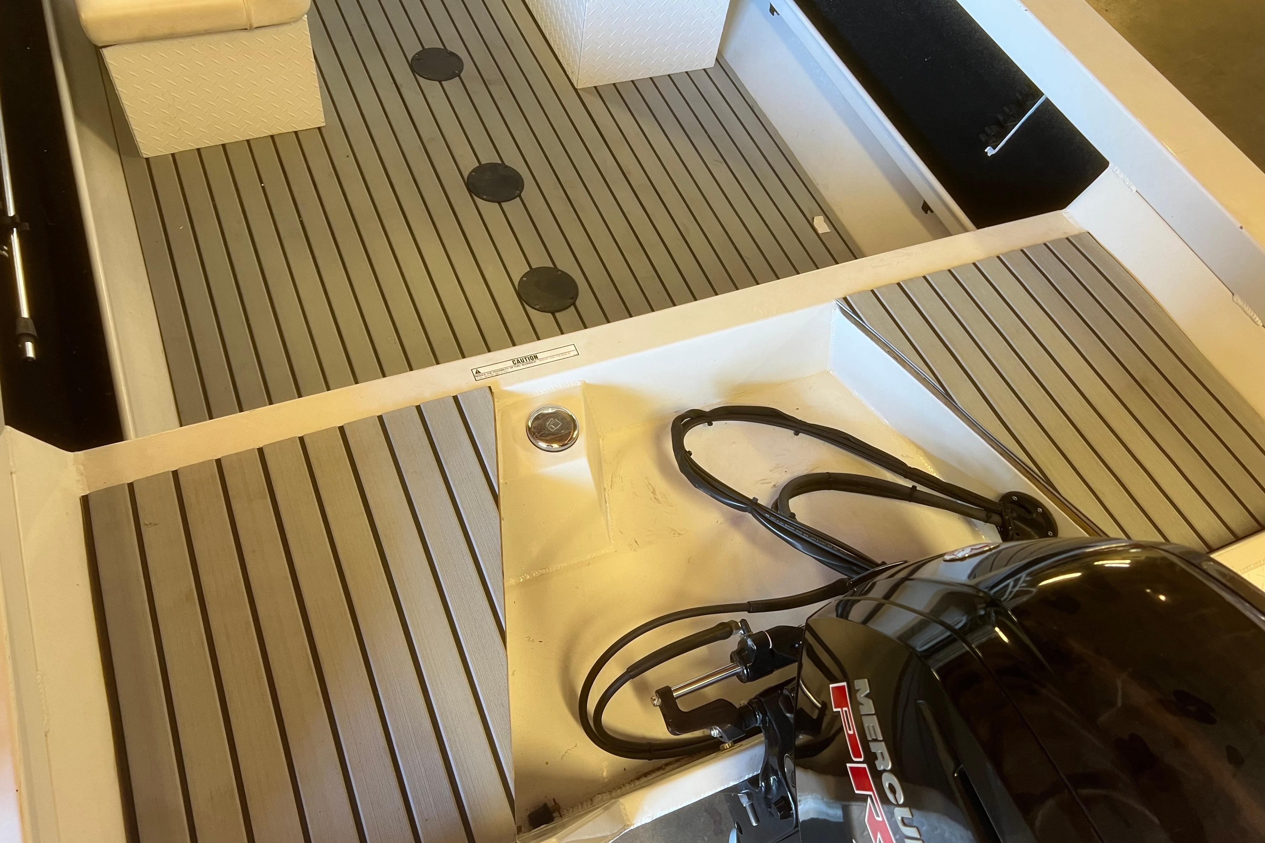 Interior view of 2019 KingFisher 1825 Falcon boat with Mercury engine.