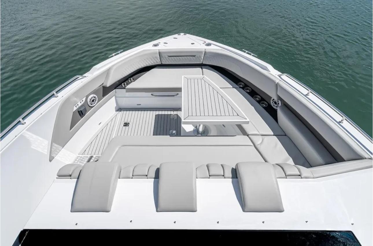2025 Cruisers Yachts 50 GLS luxury boat interior with seating and table on water.