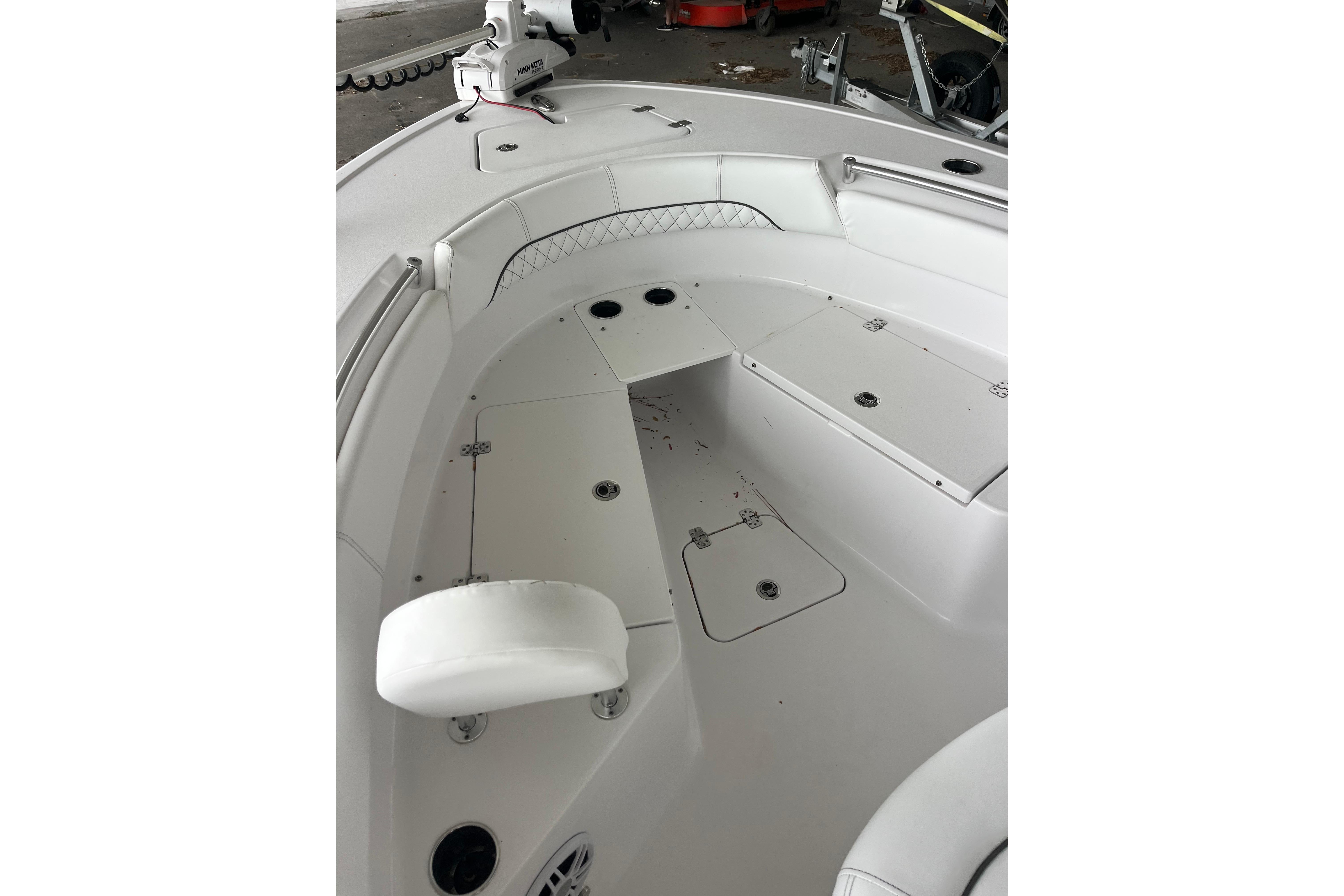 2024 Sportsman Open 212 Center Console boat interior with seating and storage compartments.