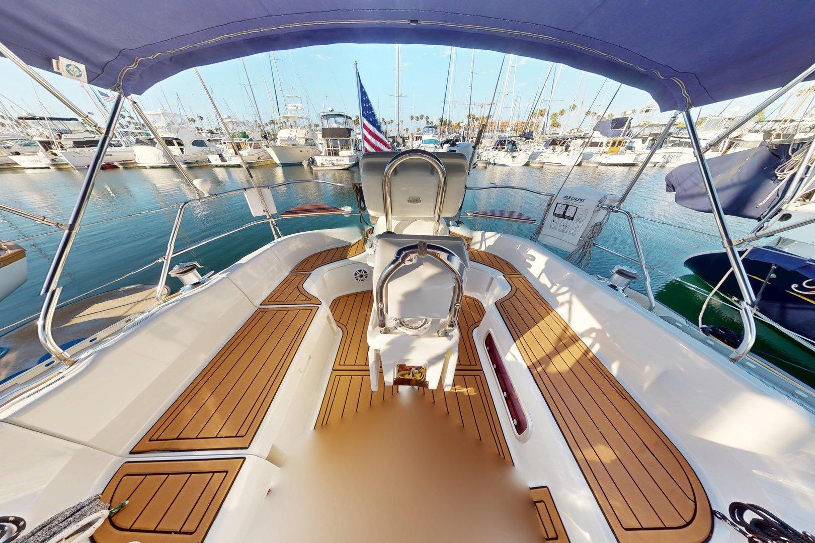 Cockpit view of 1997 Hunter Legend 40.5 sailboat docked in marina.