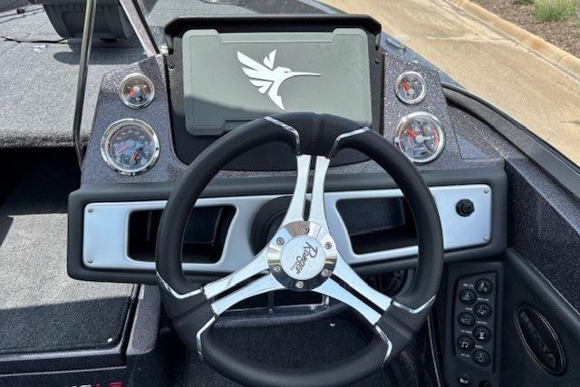 Steering wheel and dashboard of 2026 Ranger 212LS boat with modern controls.