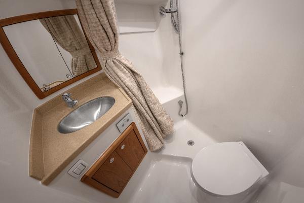 2025 Albemarle 36 Express bathroom with sink, shower, and toilet.
