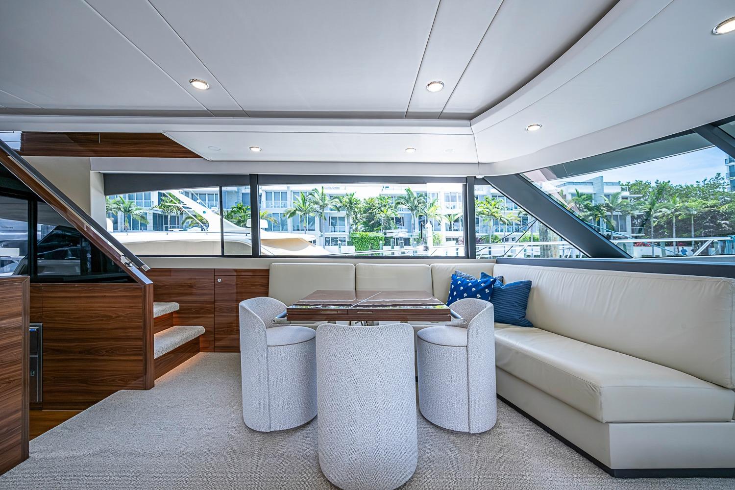 Luxurious interior of 2025 Maritimo M75 yacht with elegant seating and modern design.
