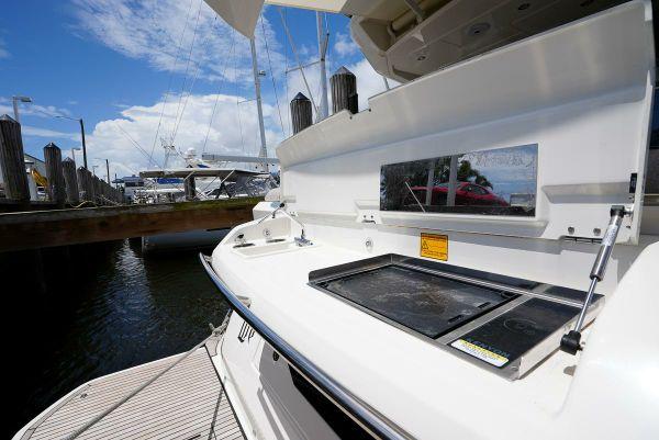 Beneteau Monte Carlo 52 yacht outdoor kitchen area, 2021 model, docked at marina.