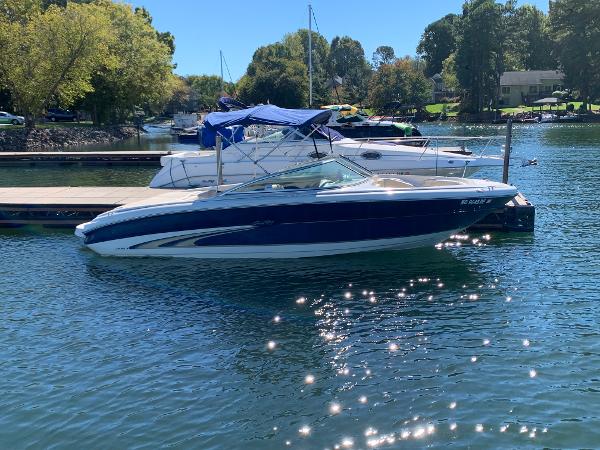 2000 Sea Ray 210 Bow Rider boat docked on a sunny day.