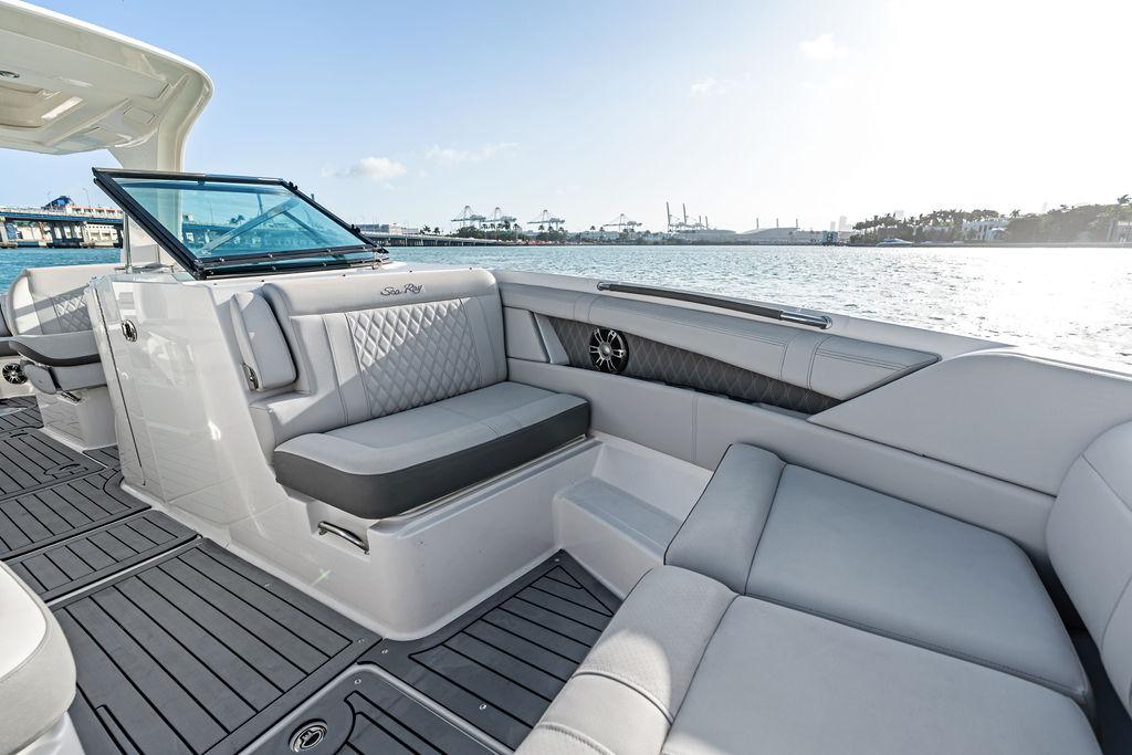 2021 Sea Ray 350 SLX OB boat interior with luxurious seating and waterfront view.
