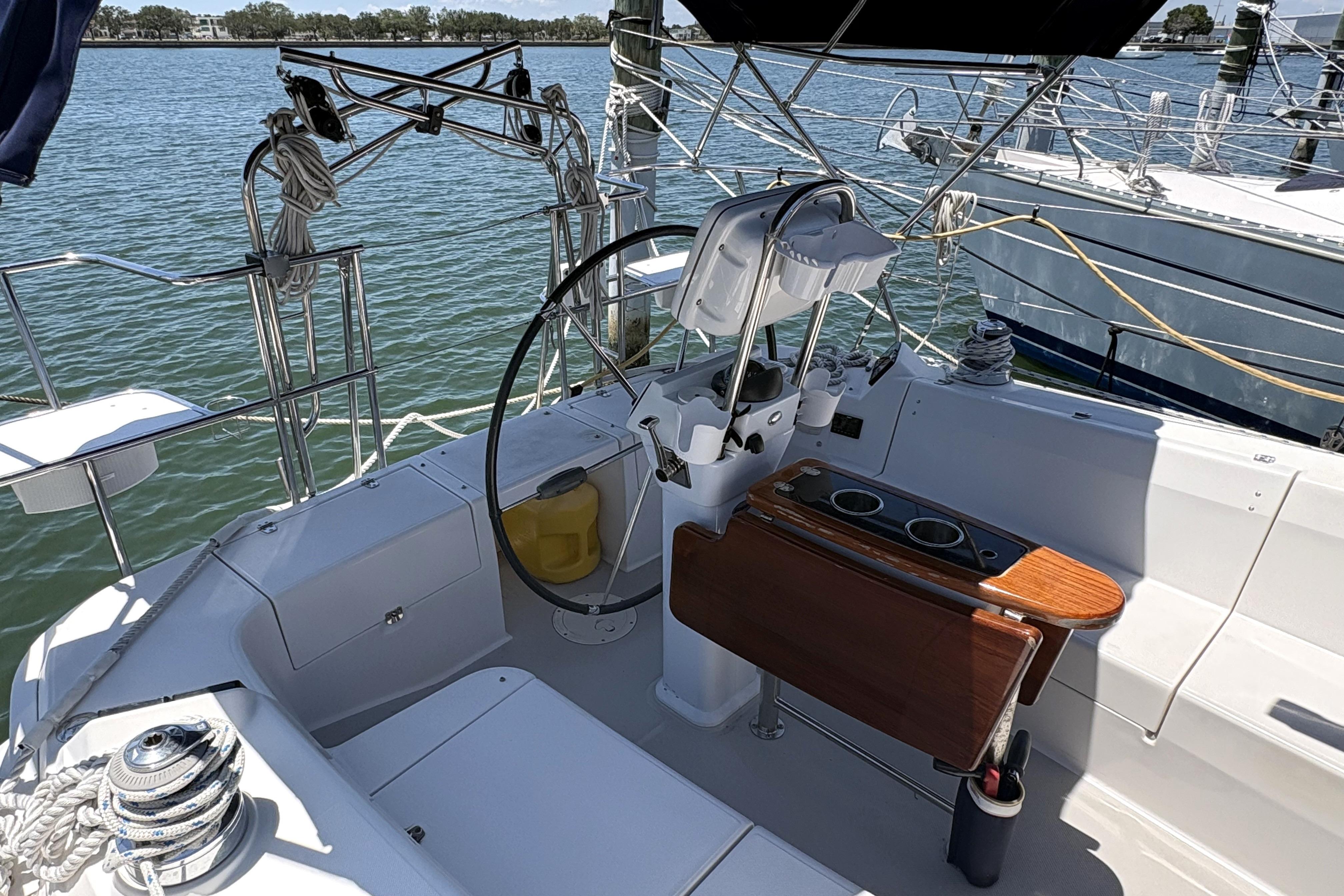 Cockpit of a 2011 Catalina 355 sailboat with steering wheel and seating.