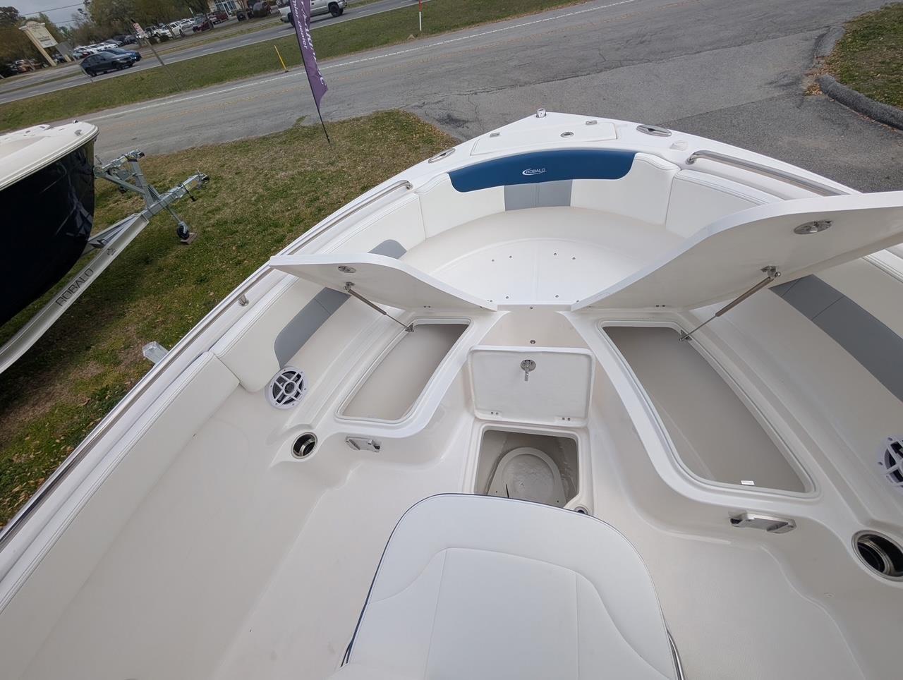 2025 Robalo R222 Explorer boat interior with open storage compartments and seating.