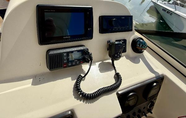 Control panel of a 2016 Scout 245 Dorado boat with navigation equipment.